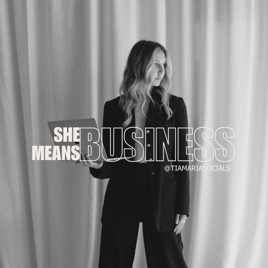 A woman dressed in business attire holding a laptop, with text overlaid that says 'She Means Business'.