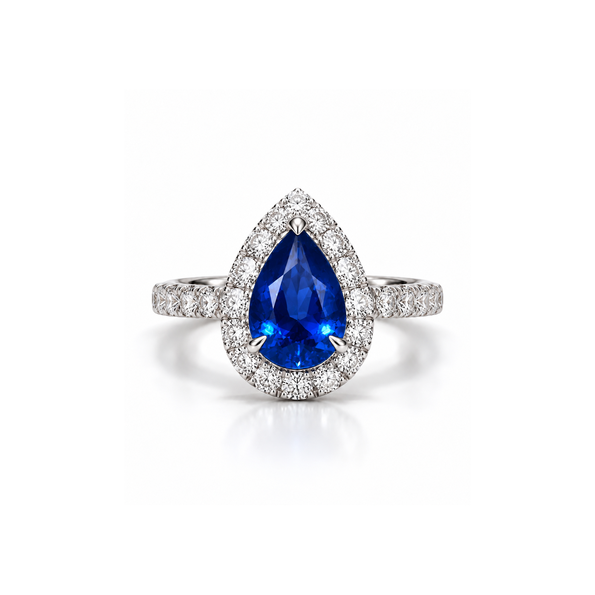 VIVI Pear Blue Sapphire Ring worn on the hand, featuring a natural pear-shaped blue sapphire surrounded by round diamonds.