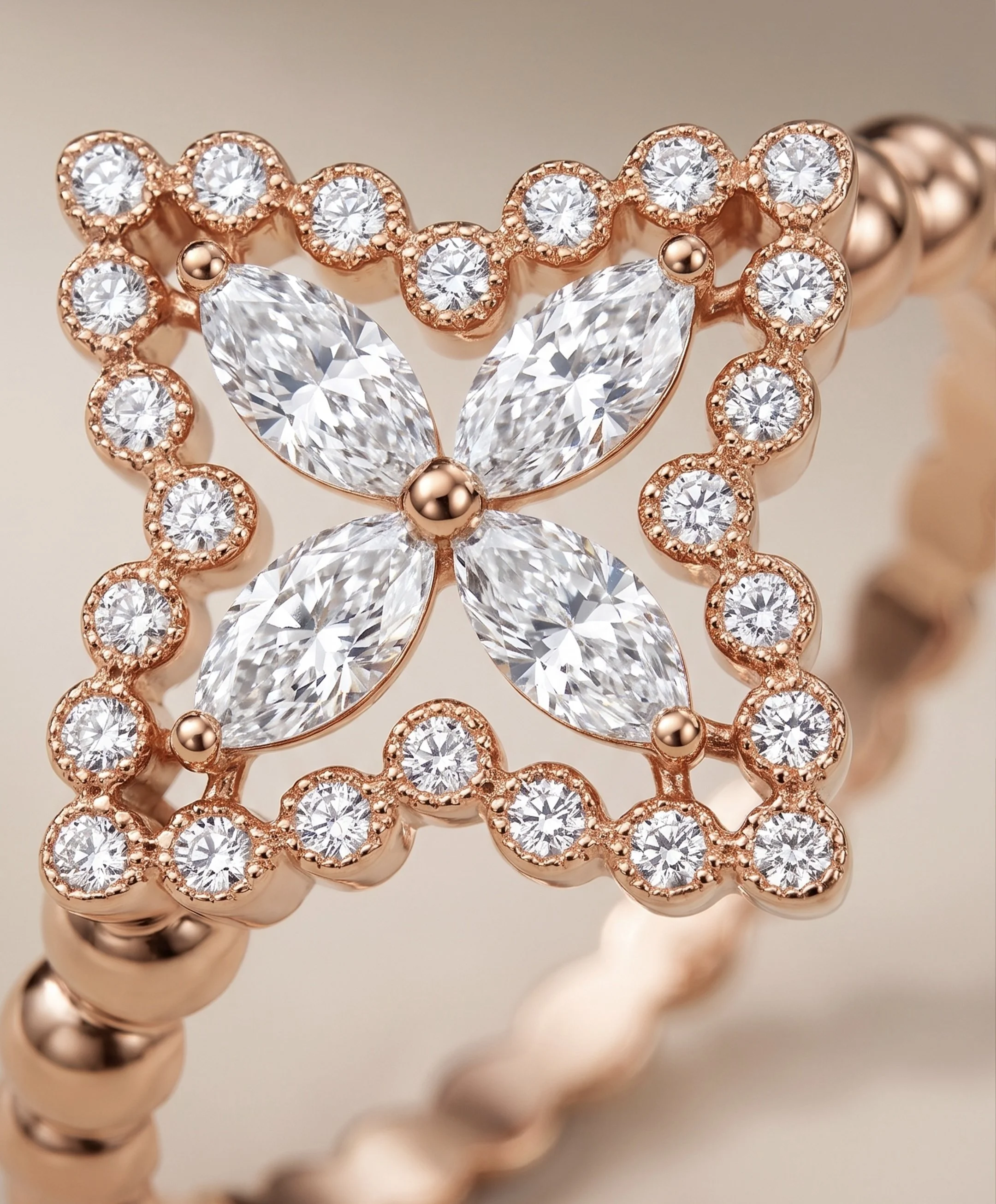 Macro view of the AIR Marquise Flower Ring showing four natural marquise diamonds and round diamonds set in 18K rose gold.