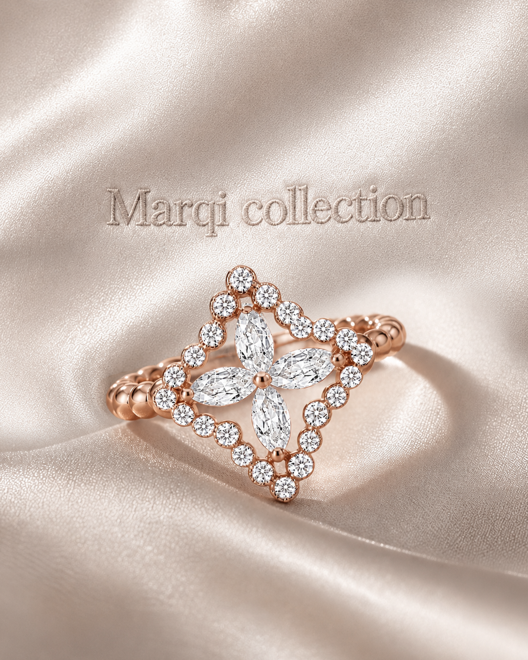 A close-up of a jewelry box or display with a rose gold ring and a matching hair accessory or brooch on satin fabric. The background has the embossed text 'Marqi collection' on satin.