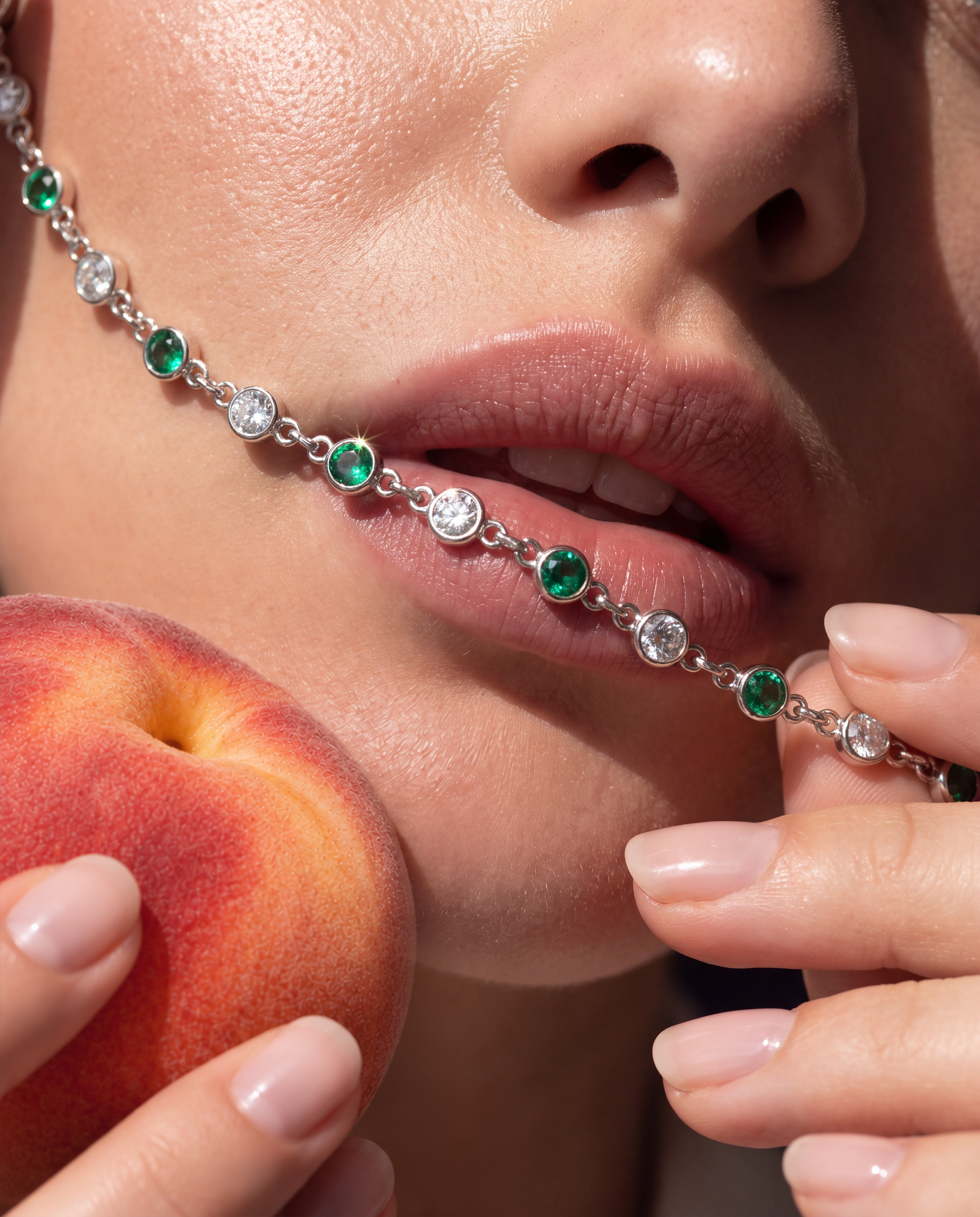 DUO Bracelet with natural Colombian emeralds and round diamonds shown in a close-up jewelry campaign portrait.