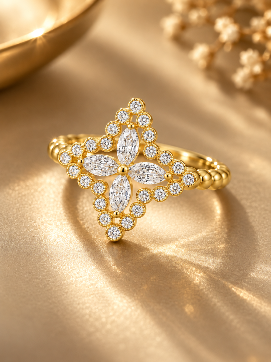 Perspective view of the AIR Marquise Flower Ring in yellow gold, showing the four-petal marquise diamond center and open diamond setting.