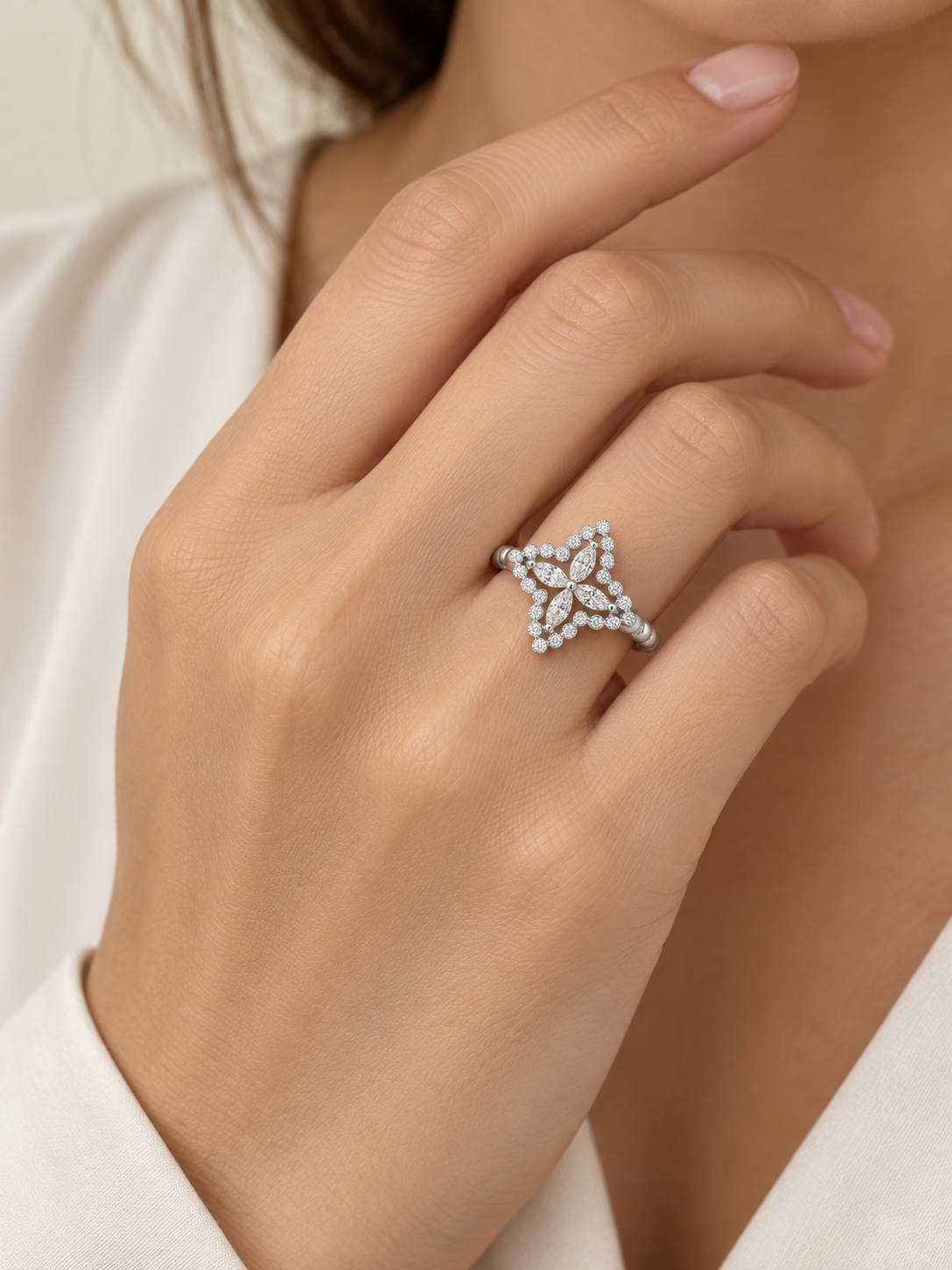 AIR Marquise Flower Ring in white gold worn on the hand.