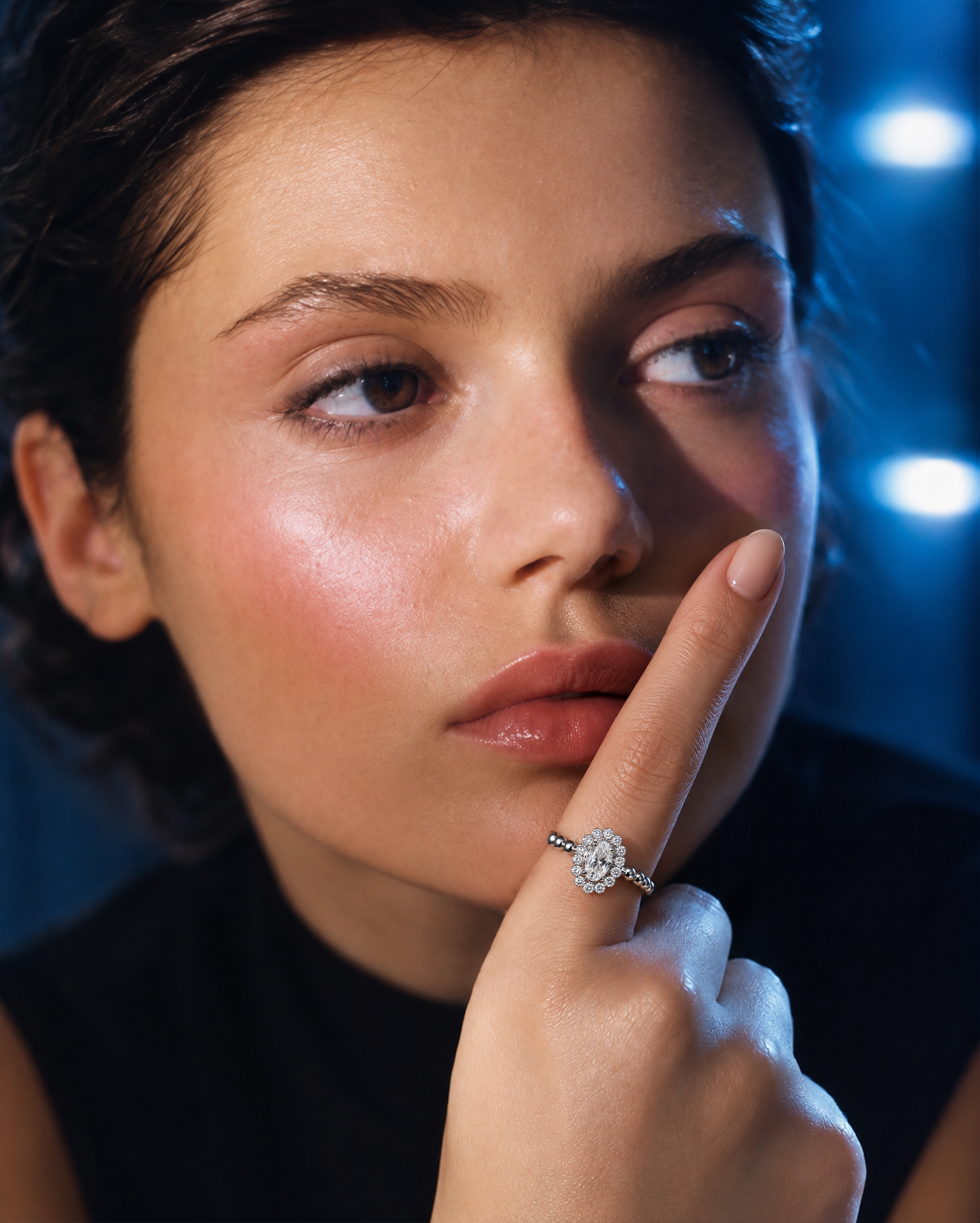 AIR Oval Diamond Ring worn on the hand, showing the oval diamond center, diamond frame and scale of the ring.