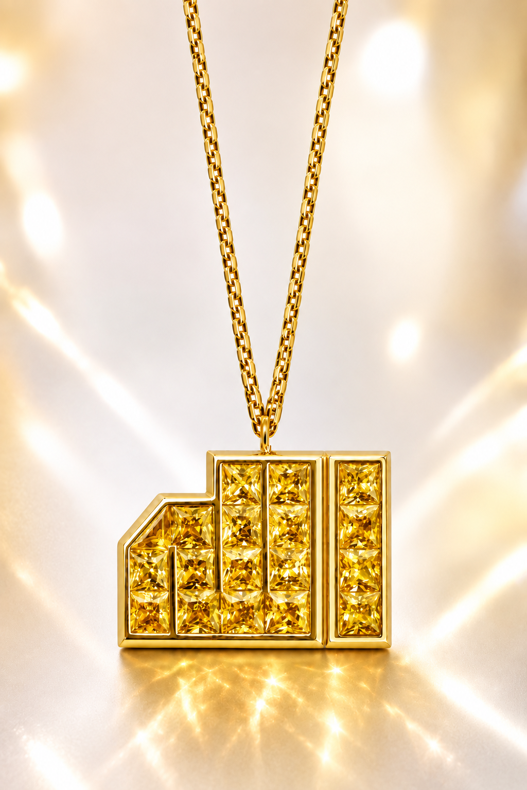 ALLAH Yellow Sapphire Pendant in 18K yellow gold set with natural yellow sapphires in its distinctive geometric form.