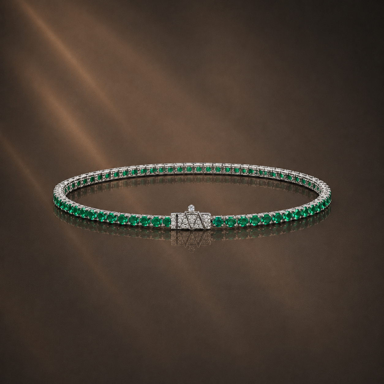 A diamond and emerald necklace with a silver clasp, displayed on a reflective dark surface.