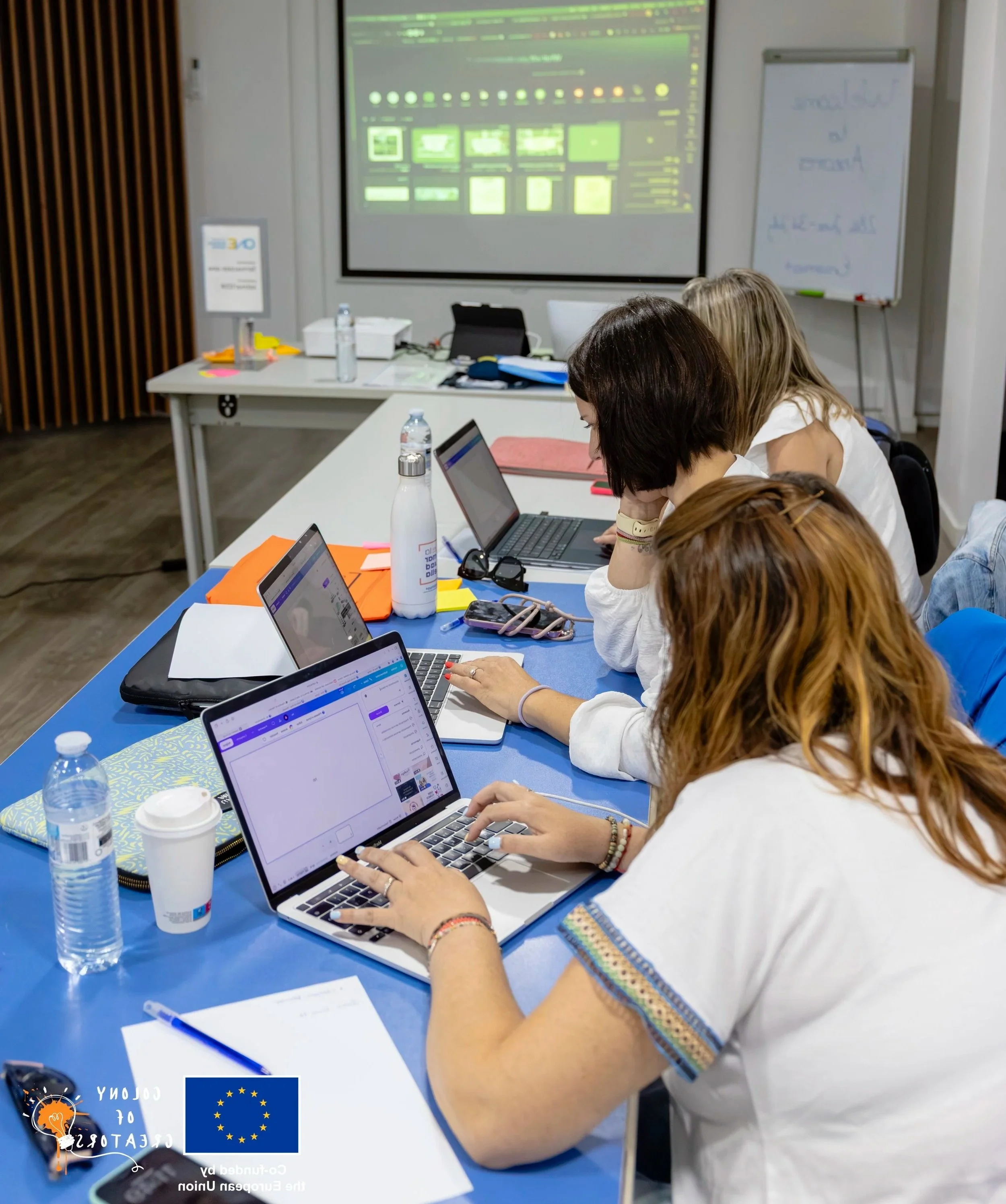 Educators using Canva AI and Magic Studio tools to design lesson materials and project resources during an Erasmus+ training course.