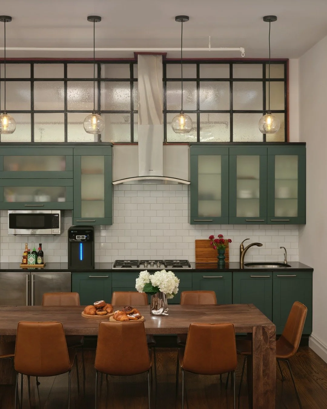 before and after 💫 a quick refresh on a kitchen in a shared office space.

my painter was able to refinish the existing cabinets and swap out the hardware. the green suited the existing floors, the company's brand palette, and maybe inspired inadver