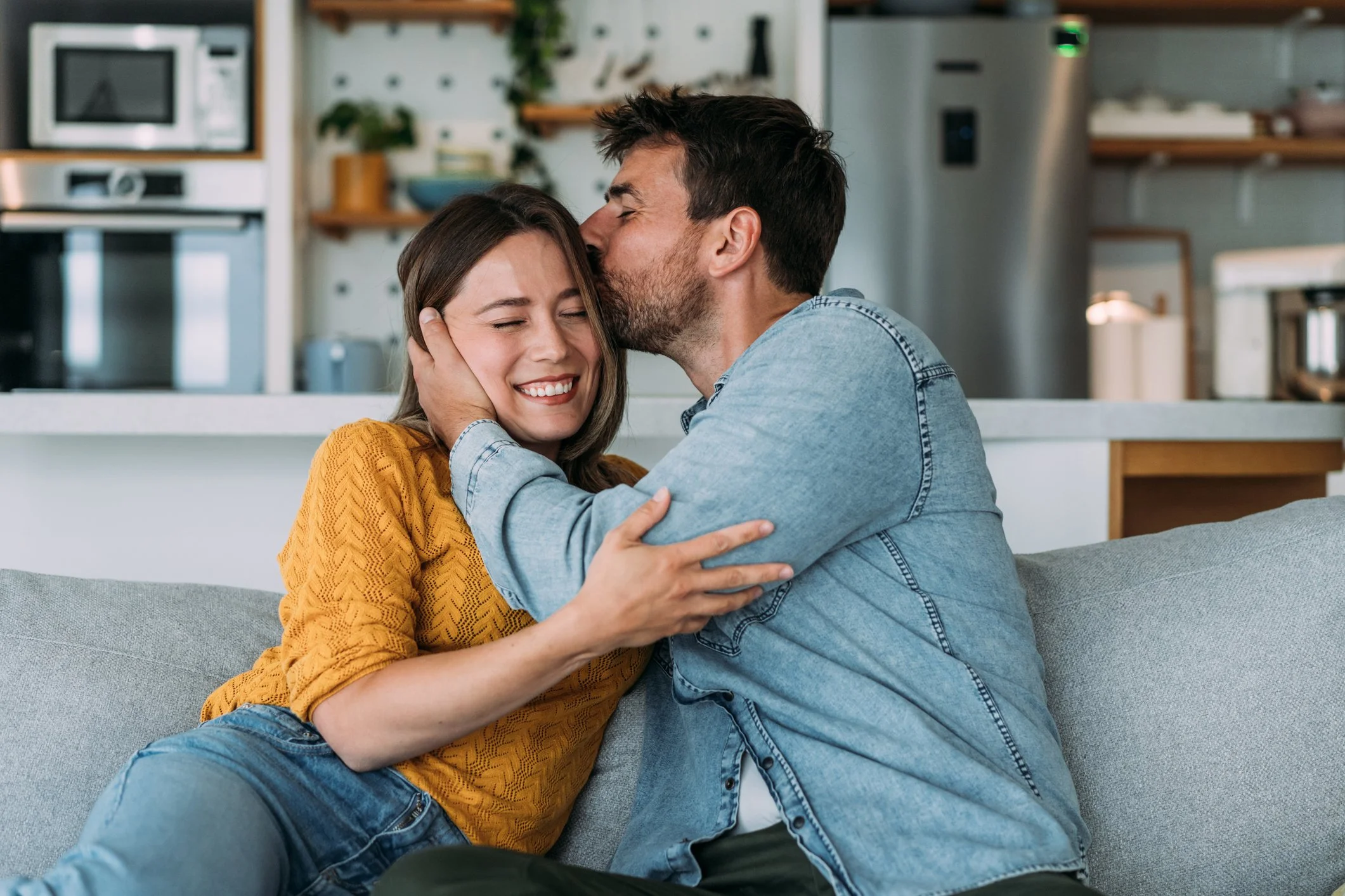 Couple reconnecting and embracing during couples therapy intensive.