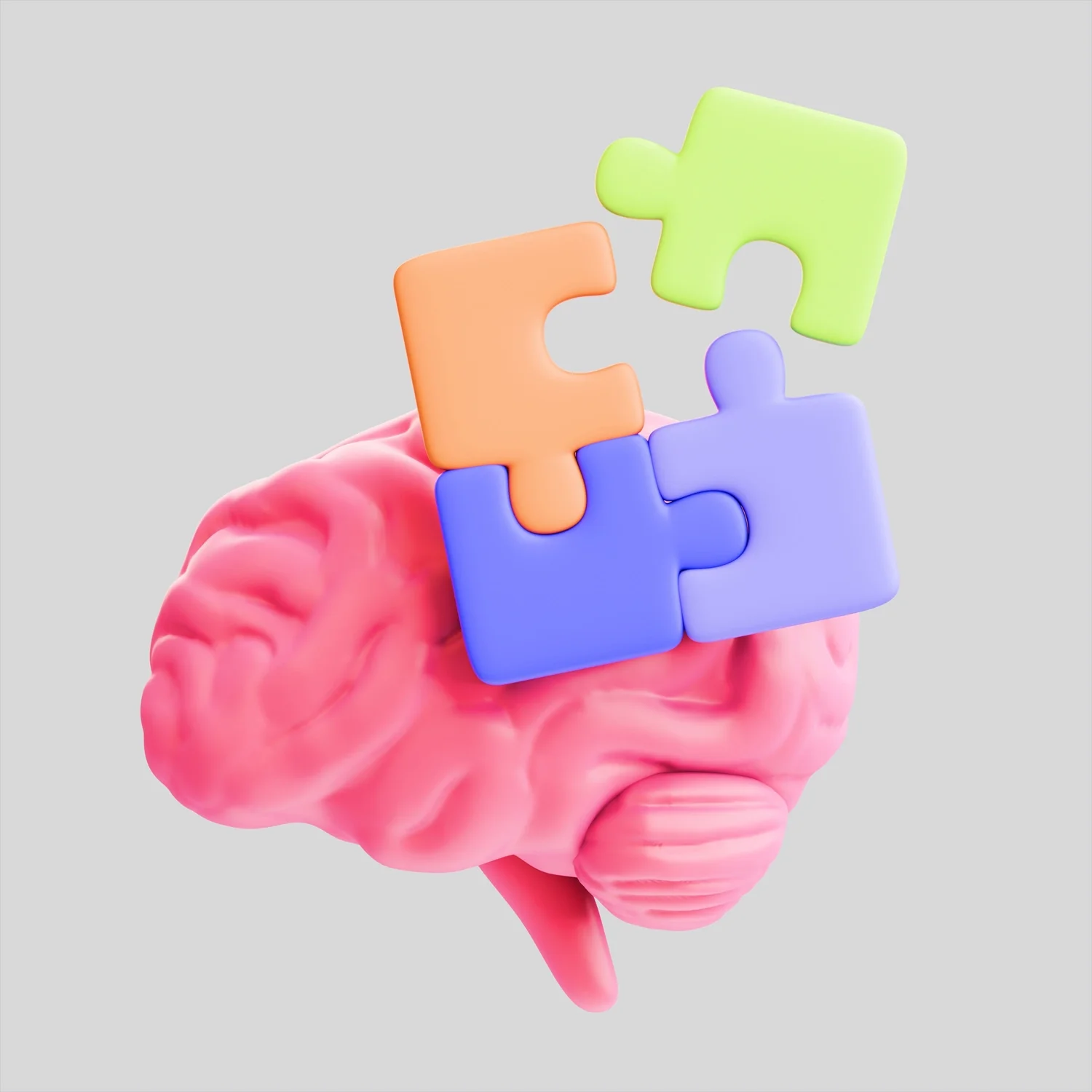 A pink brain with colorful puzzle pieces on top.