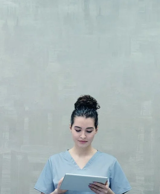 Image: Female looking at iPad