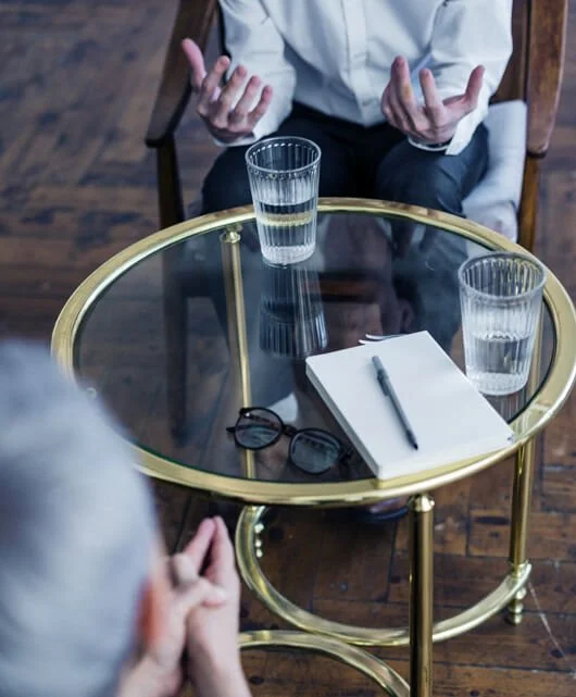 Image: Table with people sat around it