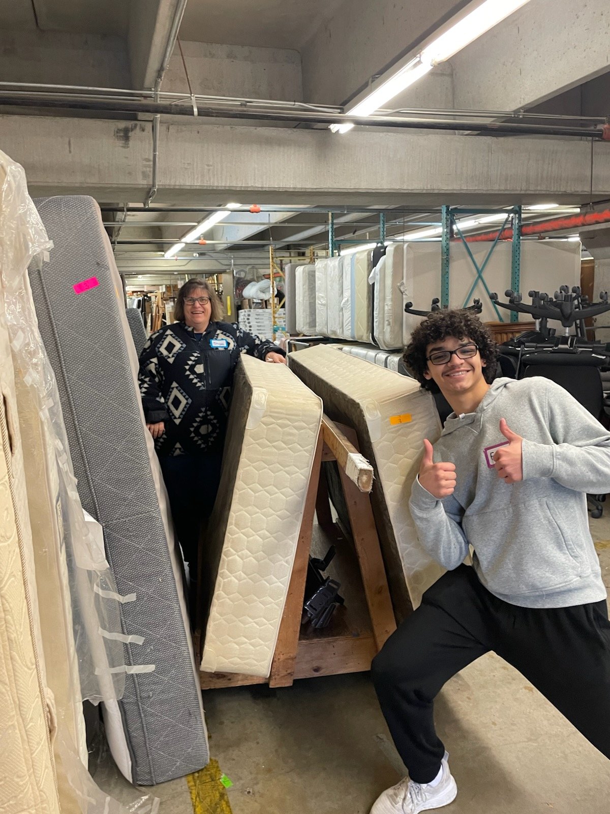Fin and Stacy get beds ready for guests