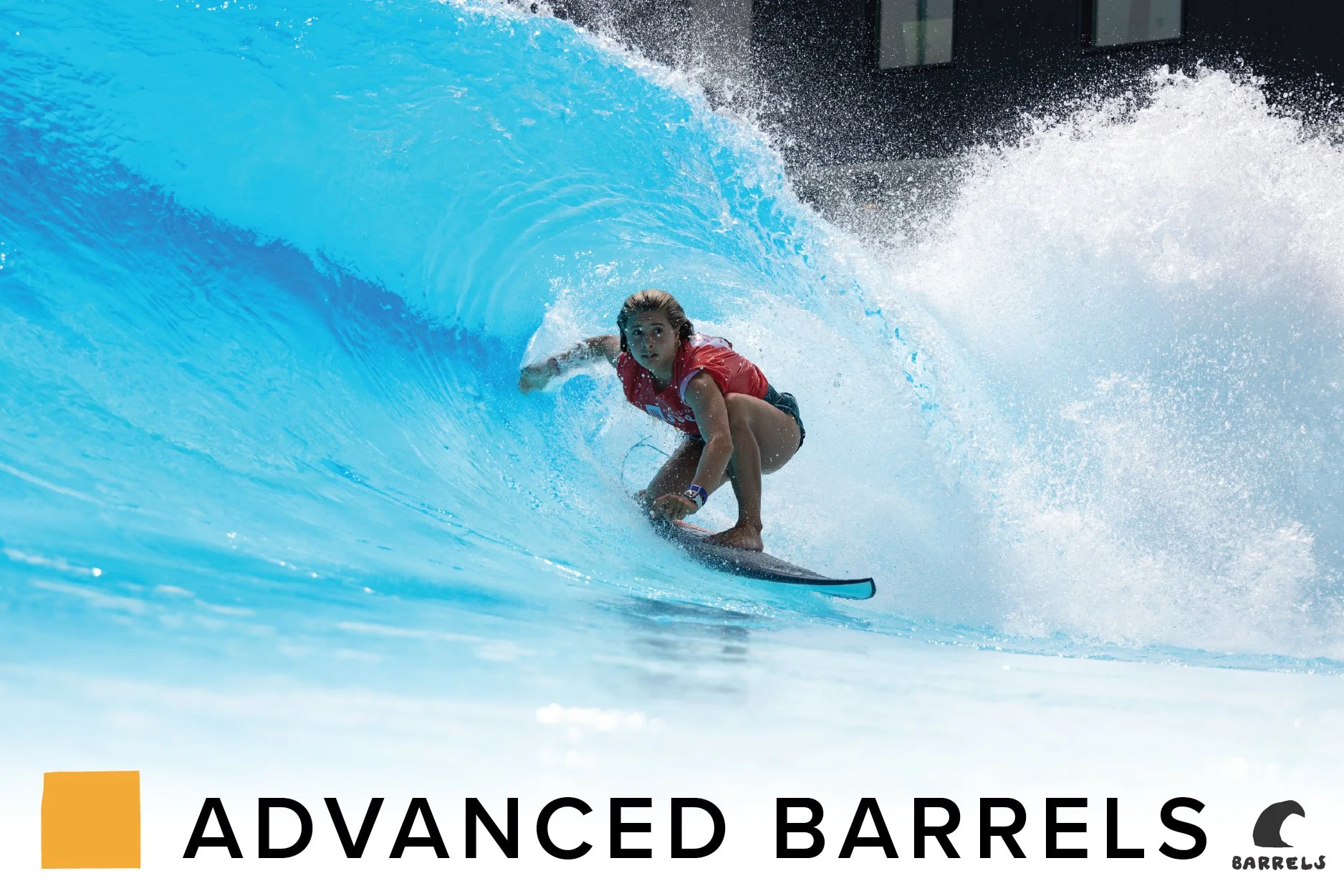 A male surfer riding inside the barrel of a large blue ocean wave.