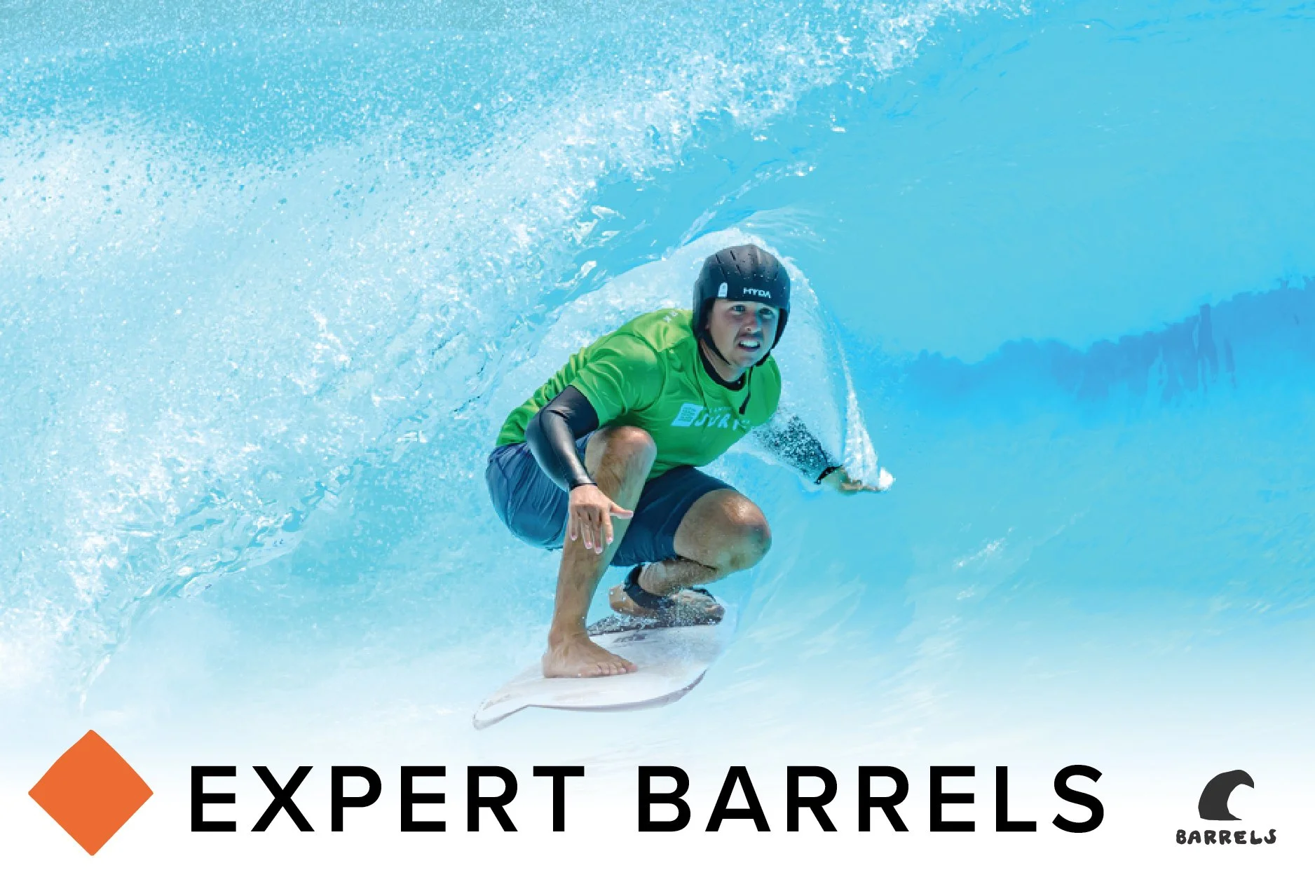 A surfer wearing a red shirt and gray shorts riding inside a bright blue ocean wave.