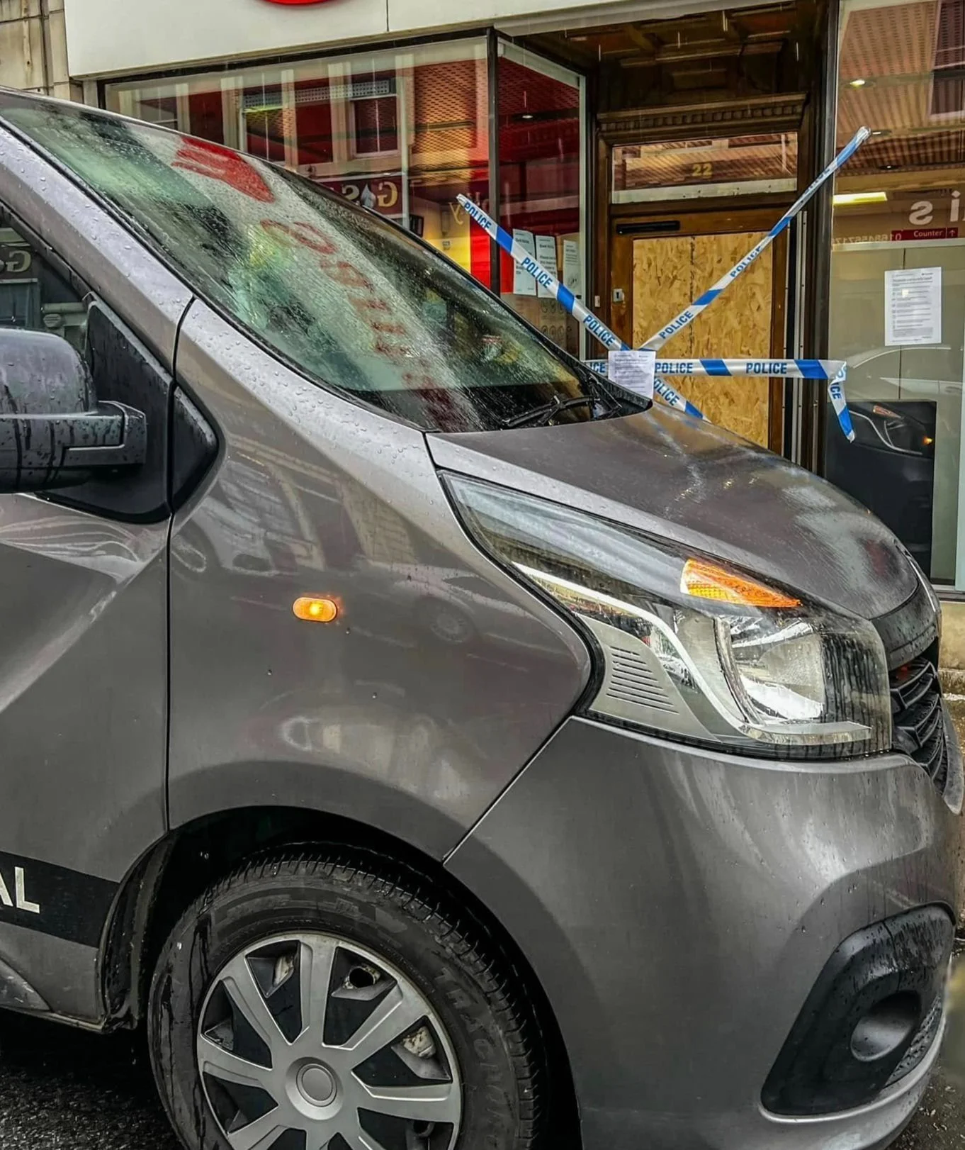 Close-up of yellow "Crime Scene Do Not Cross" tape, slightly out of focus background.