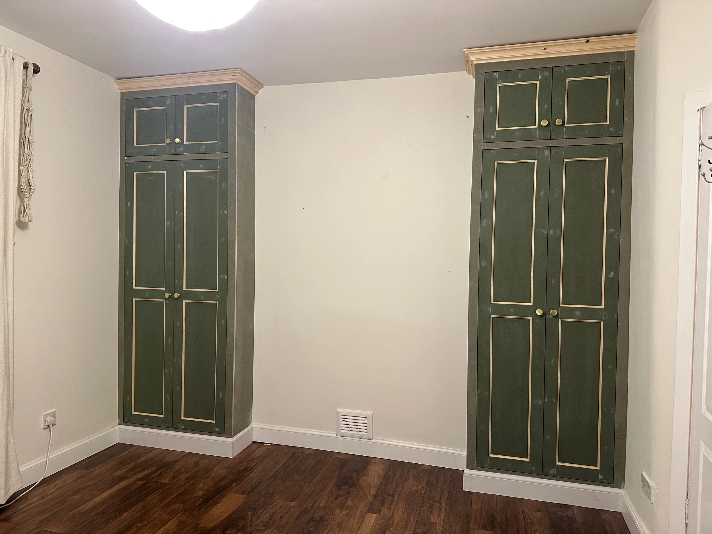 Bespoke fitted wardrobes with shaker style doors and coving and cornicing