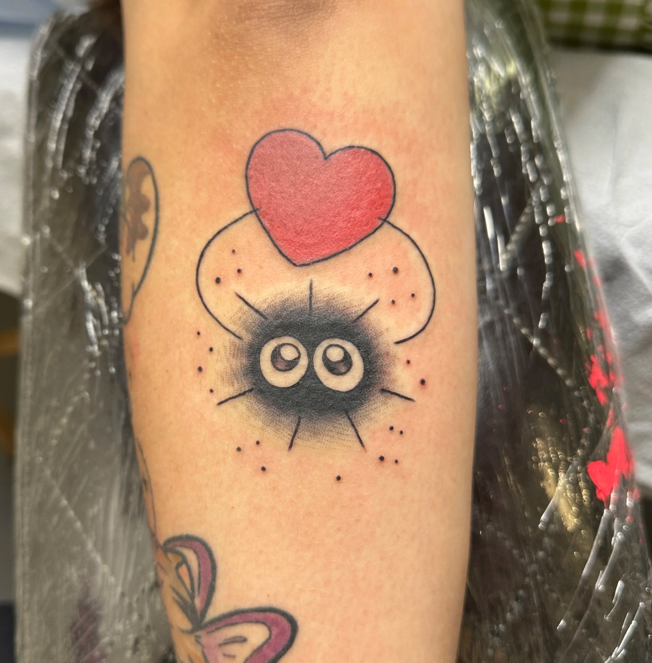 Soot sprite tattoo by Kristine Tran, woman tattooer in North Park San Diego
