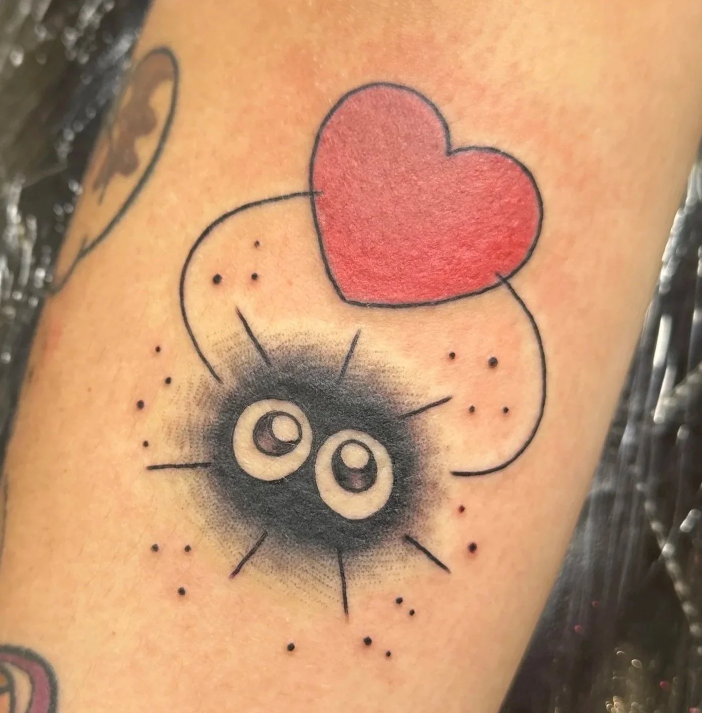 Soot sprite tattoo by woman tattoo artist in North Park San Diego, Kristine Tran