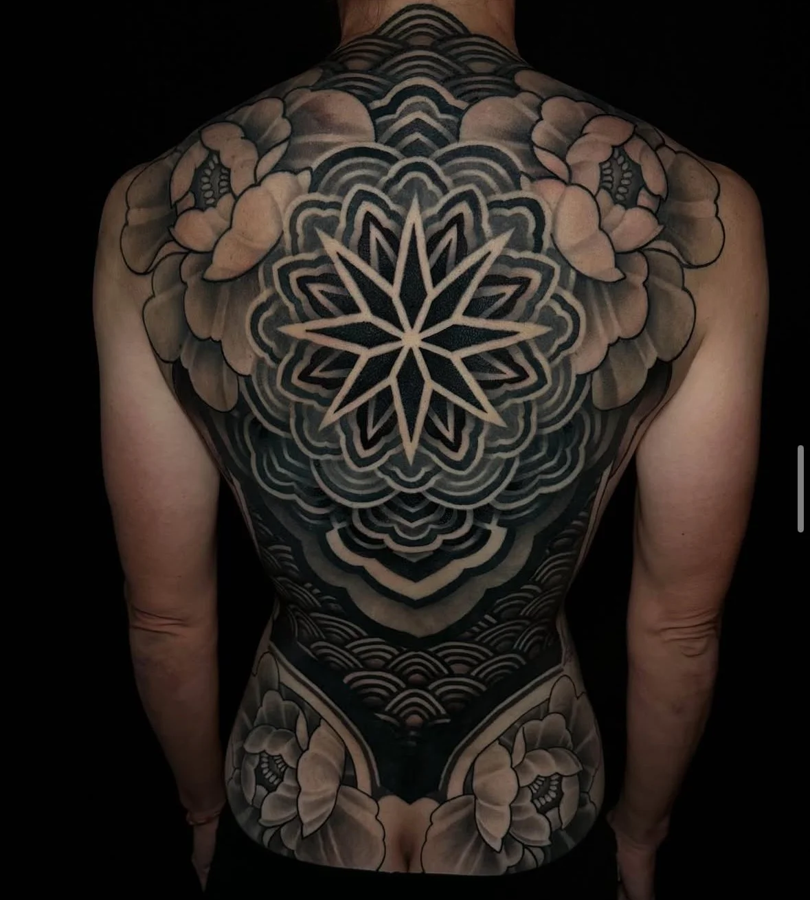 Black and grey floral tattoo by Emily Paul, woman tattoo artist in San Diego, CA