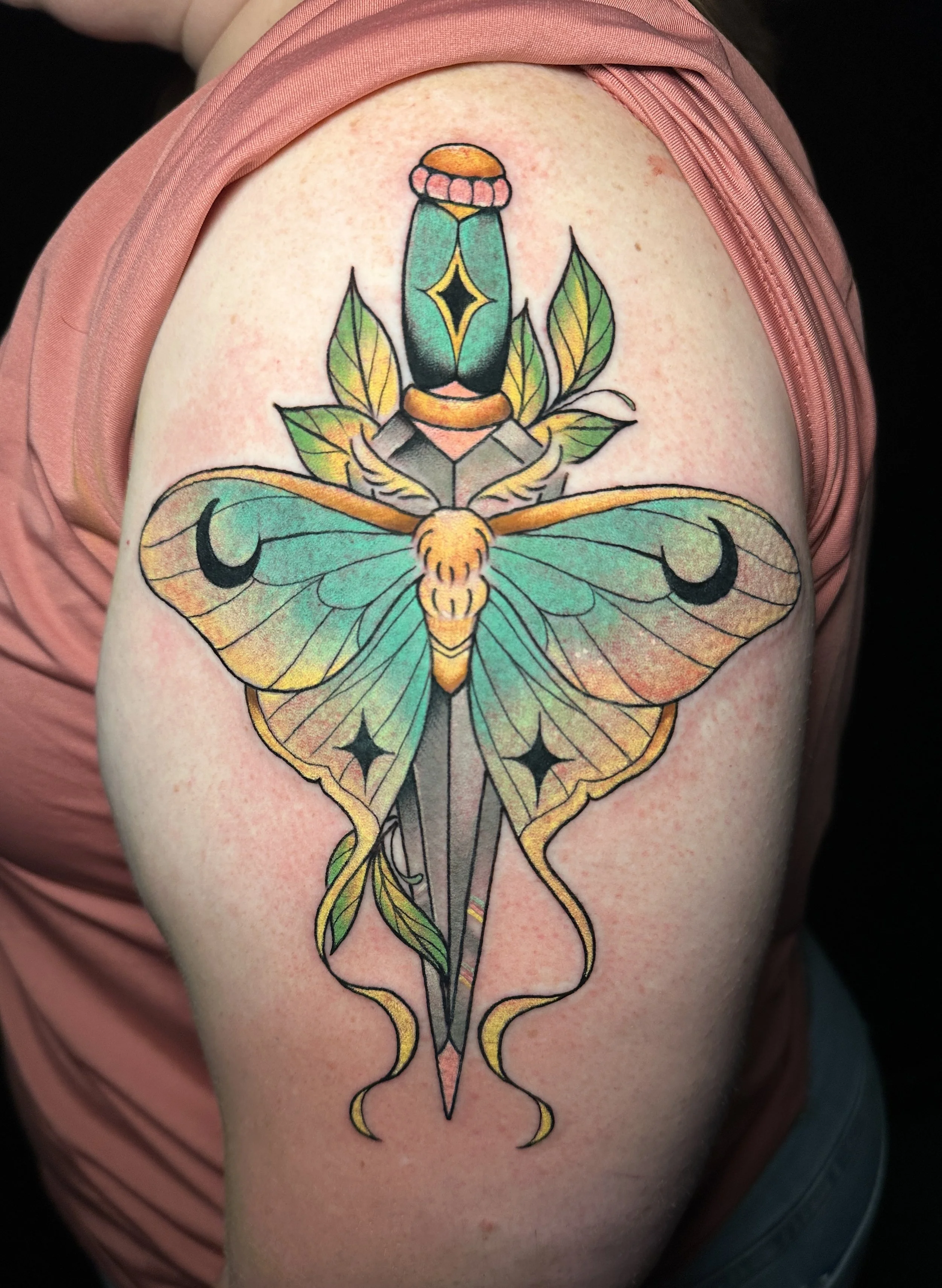 Lunar moth and dagger tattoo by ktrantattoos, woman tattoo artist in North Park San Diego