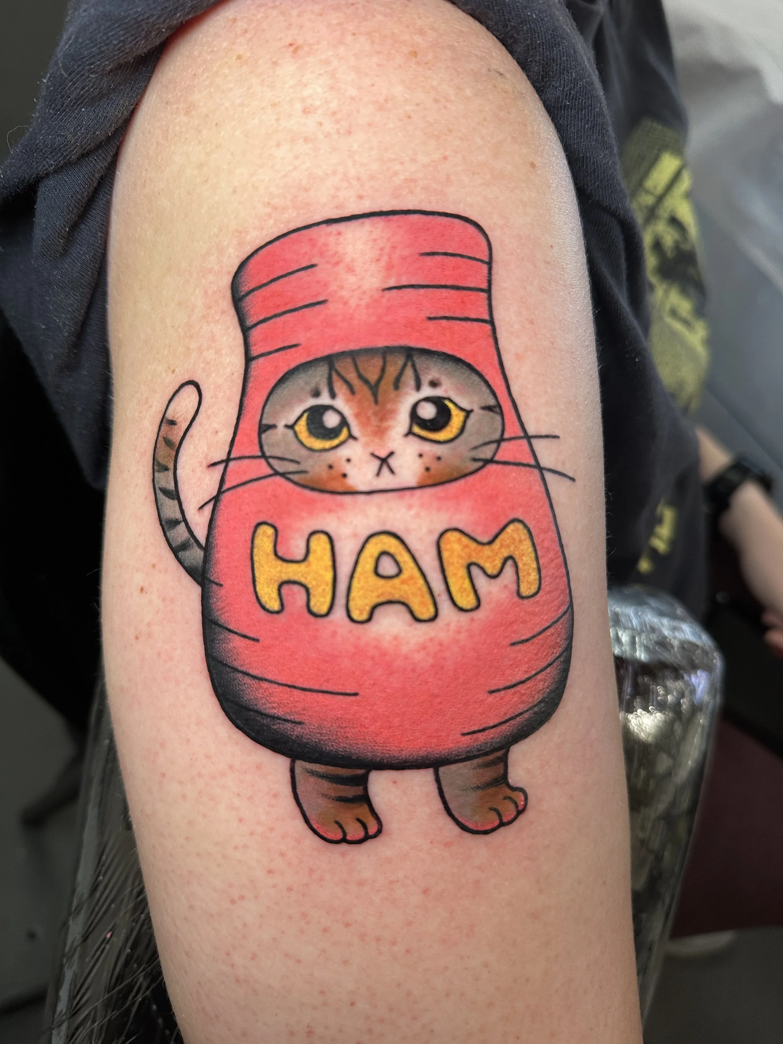 Cat tattoo by woman tattoo artist Kristine Tran at Lucky Cat Tattoo in North Park, San Diego