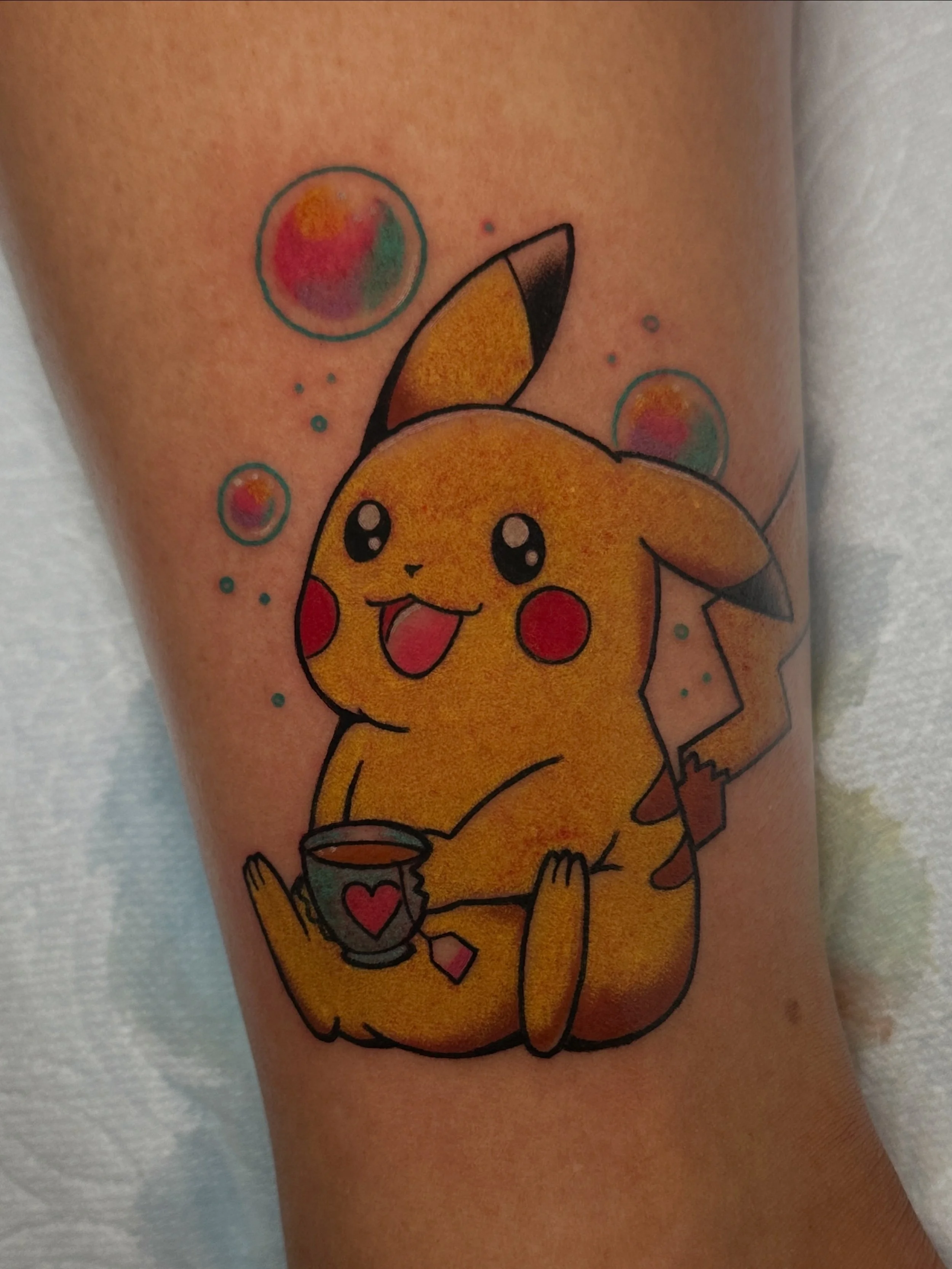 Pikachu tattoo by North Park tattoo artist Kristine Tran in San Diego, CA