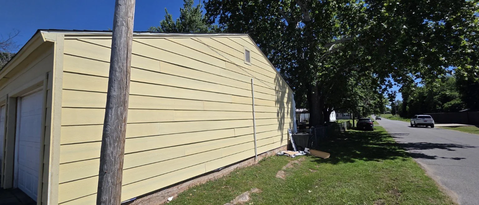 Residential exterior renovation with new siding and trim