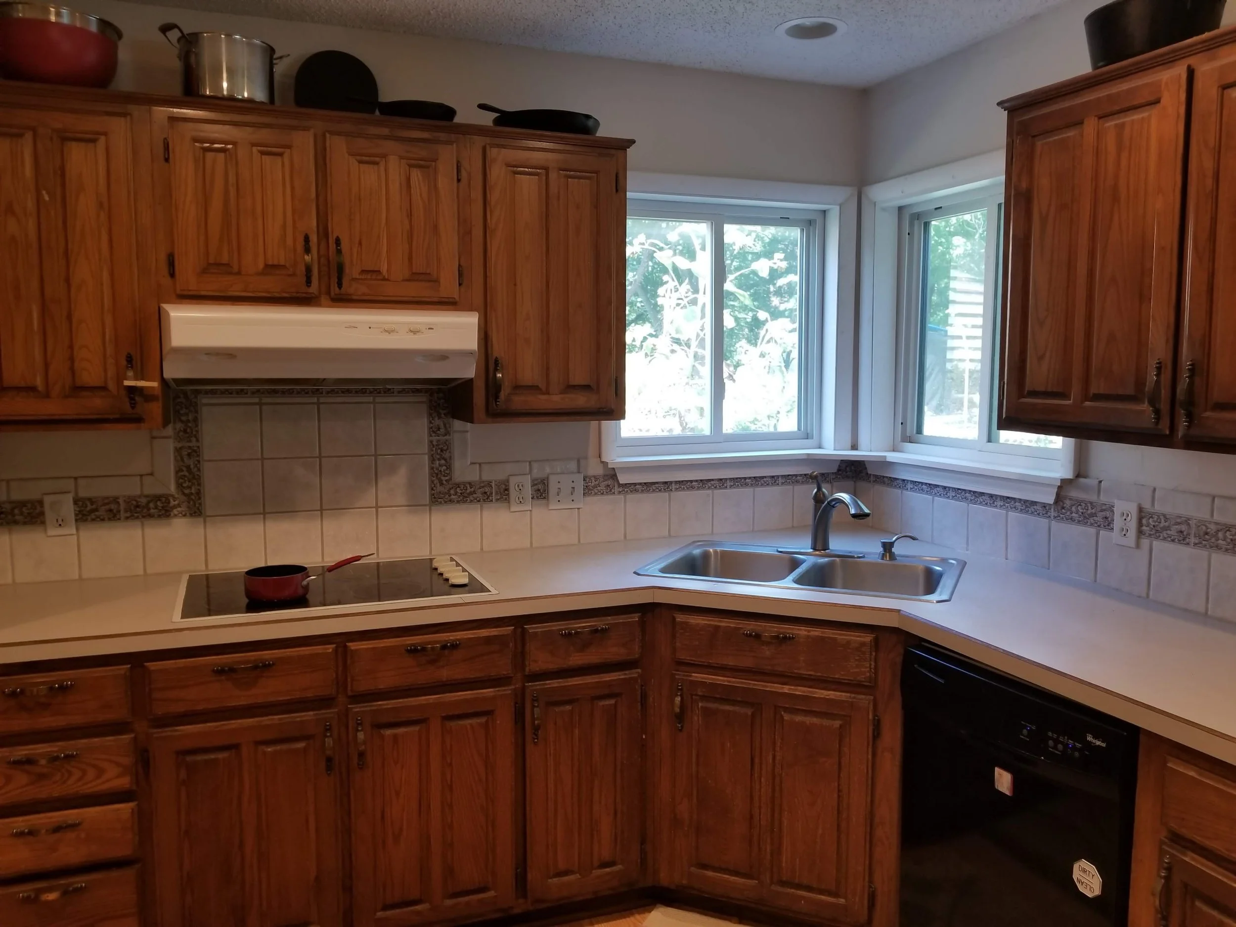 Before view of oak kitchen cabinets prior to cabinet painting and kitchen renovation