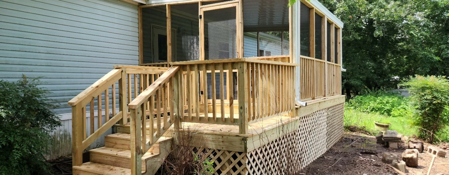 New wood deck and covered porch with stairs and railing
