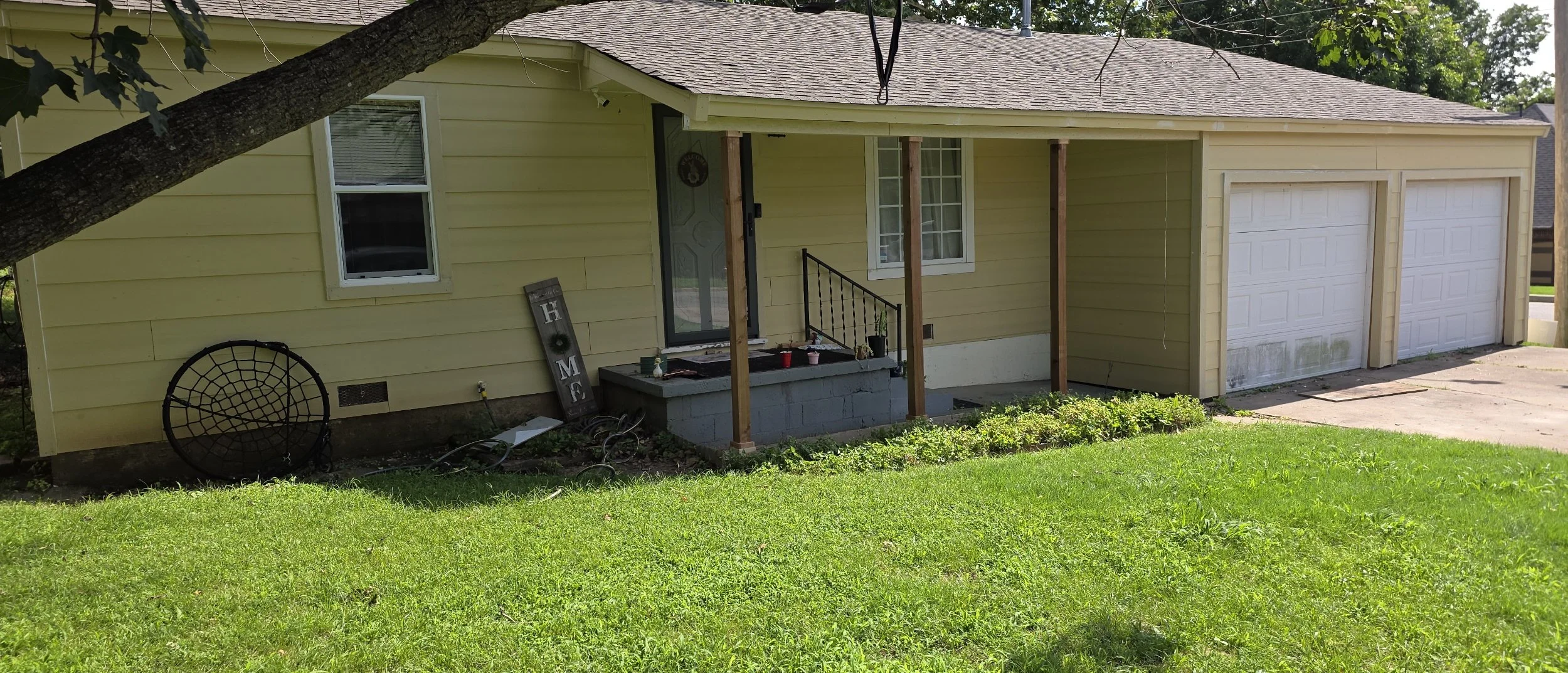 Completed exterior renovation with new siding, windows, doors and rebuilt front porch