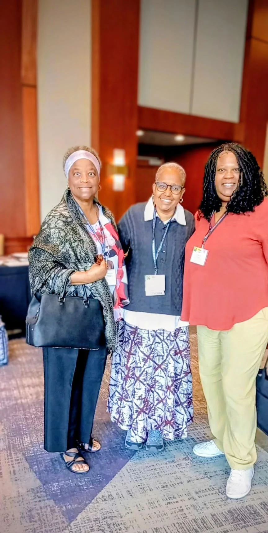 3 Bahamians, Rosalie Fawkes, Dr. Rosanne Adderley and Charlene Farrington greet each other at the ASALH CONFERENCE 2025