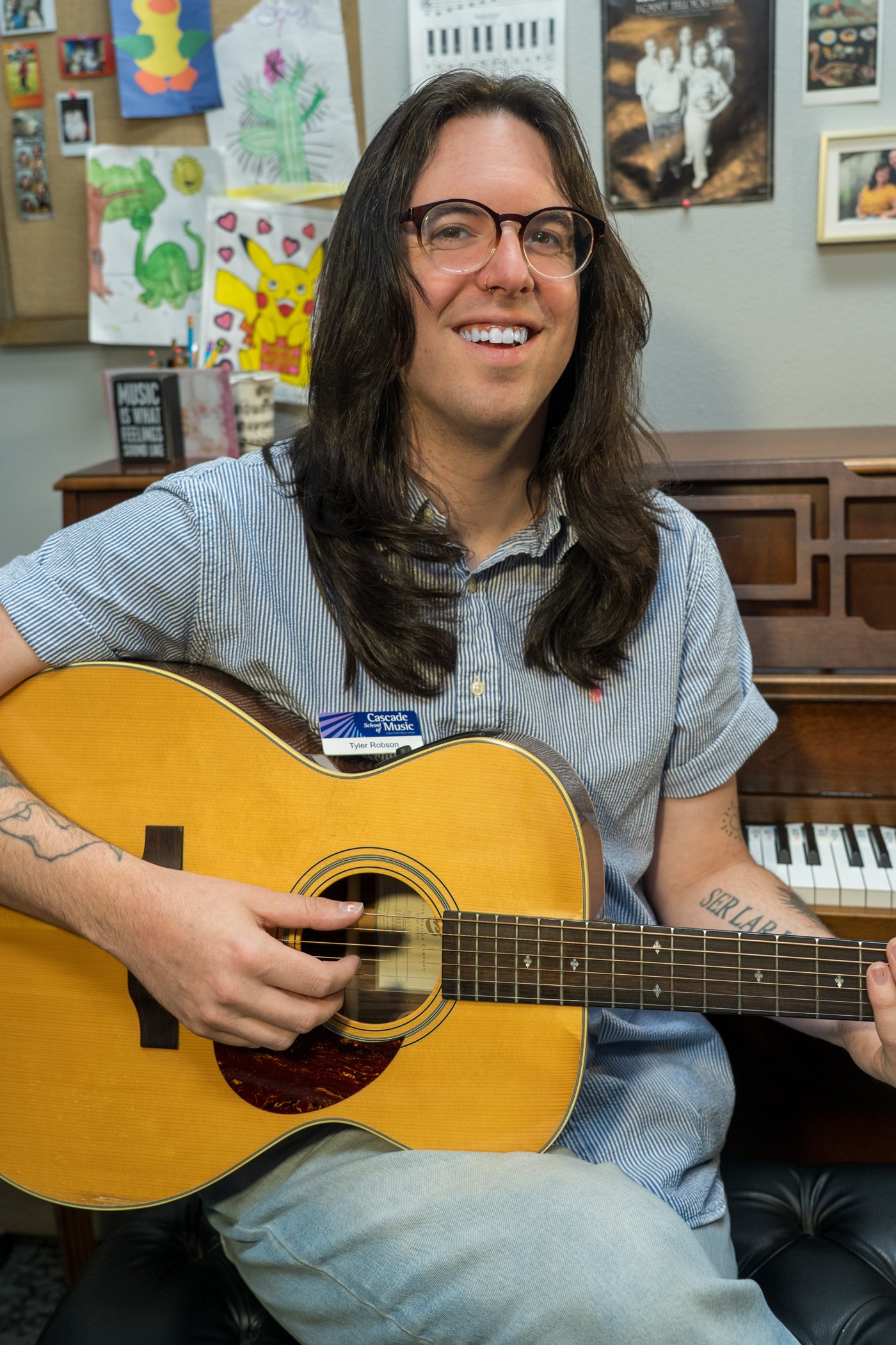 photo of Tyler Robson with guitar