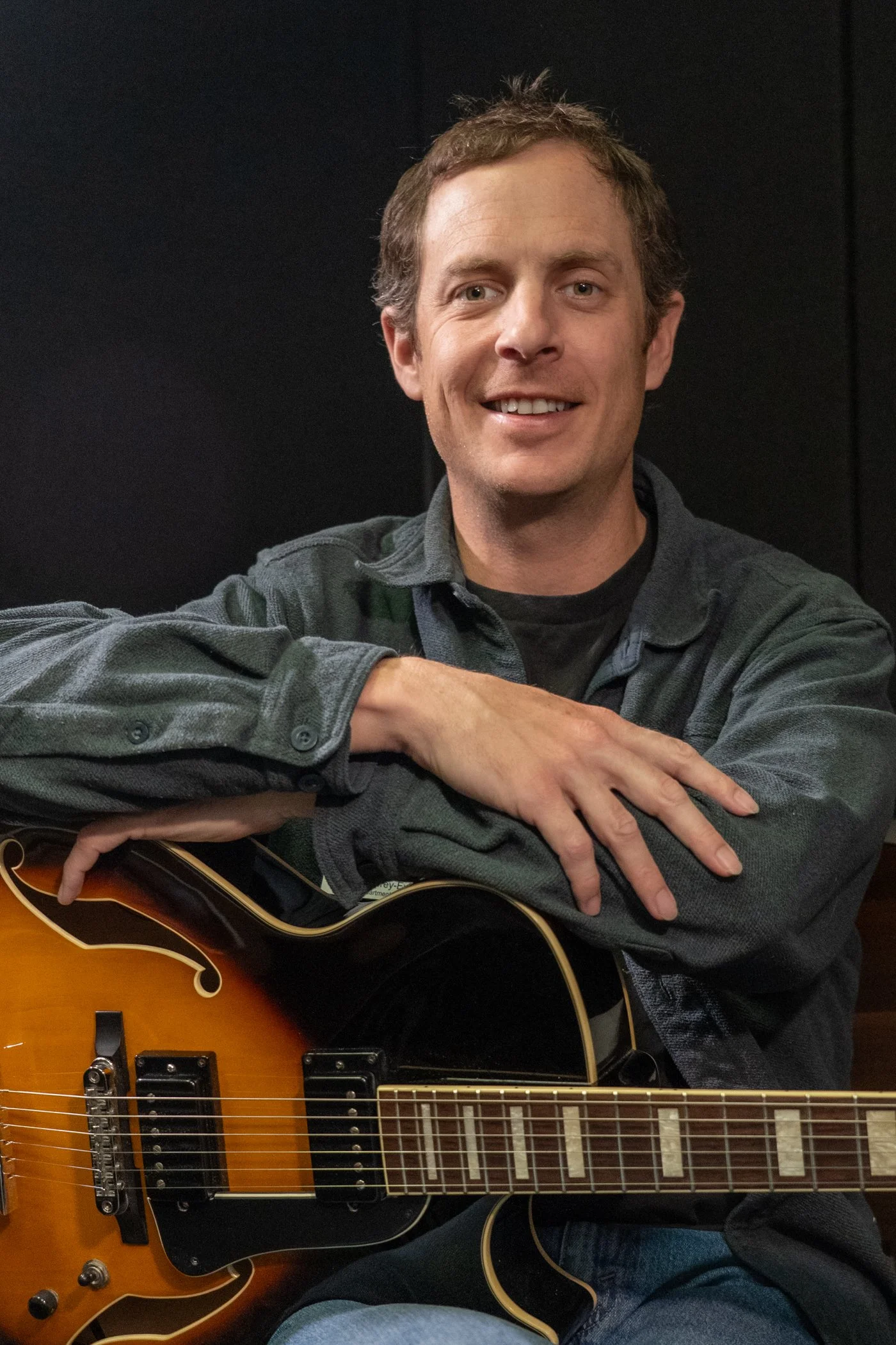 photo of Blake Lowrey-Evans with guitar
