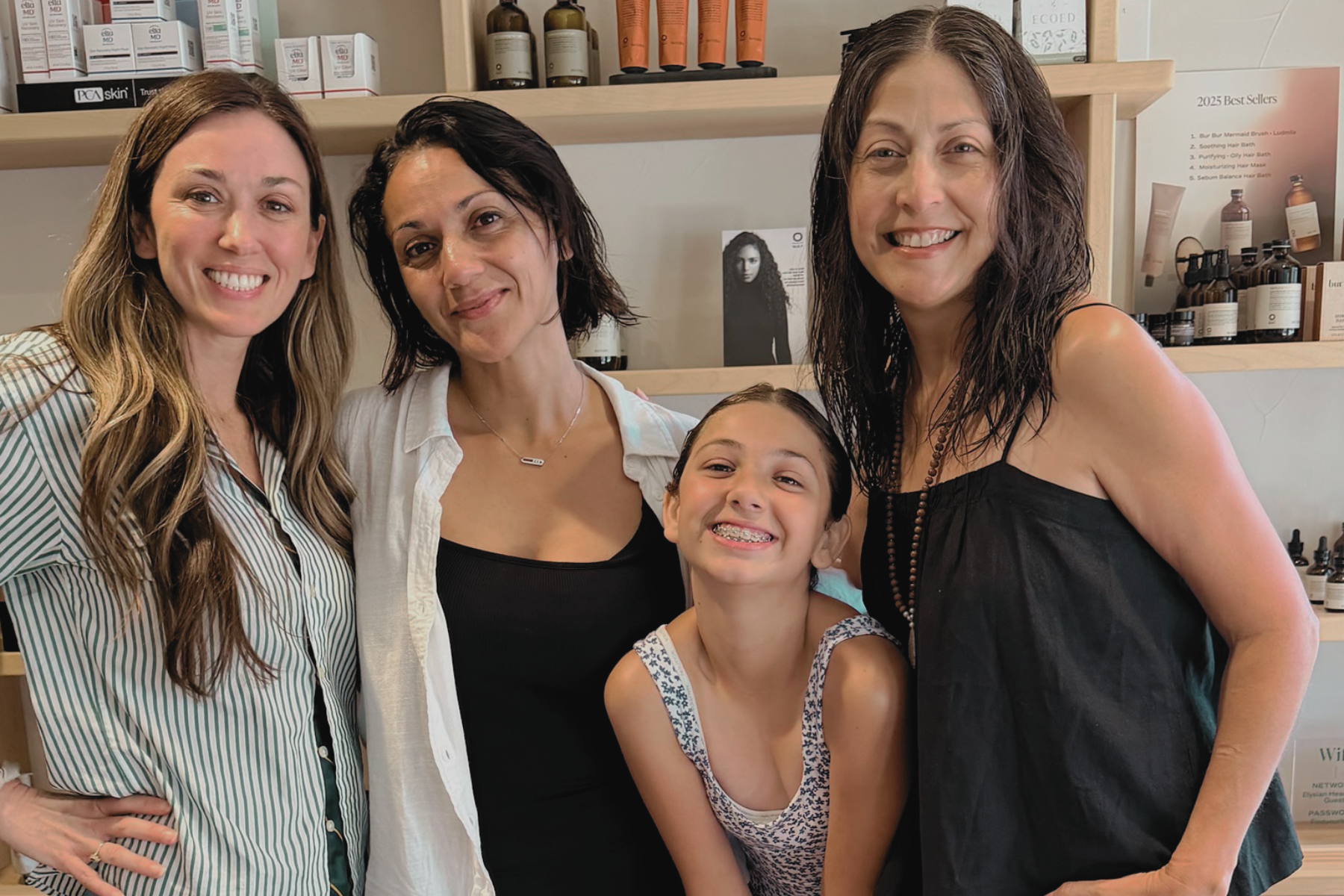 Katie Wills with clients enjoying The Little Retreat treatment with two women and one girl