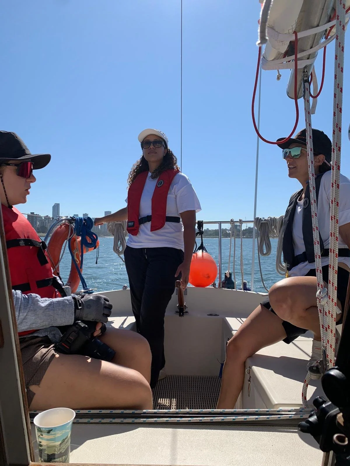 A team of women sailing together