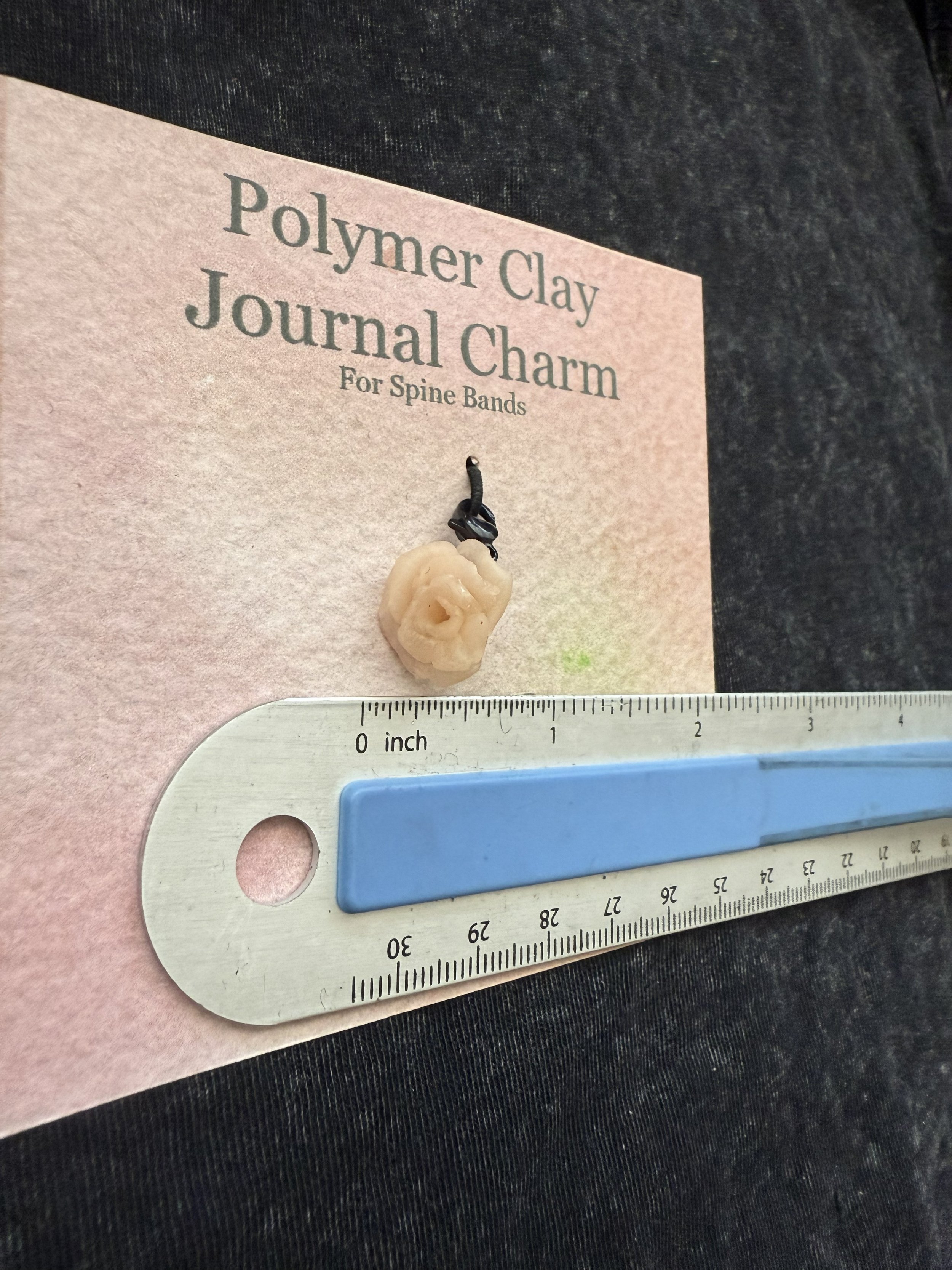 pink rose spine charm angle.jpeg