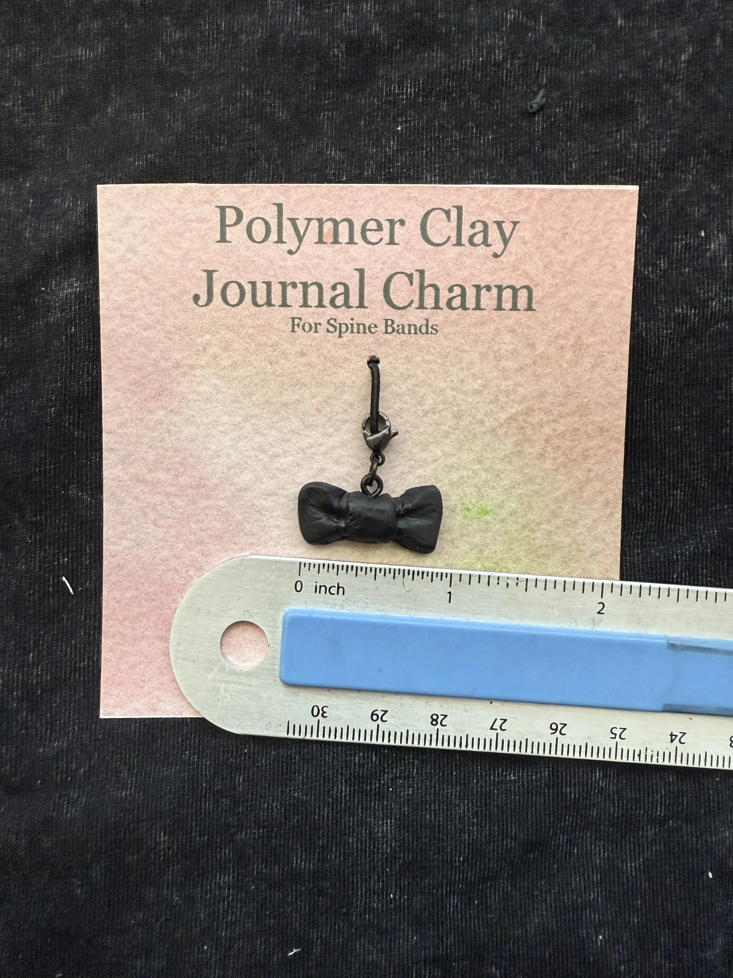 black bowtie spine charm.jpeg