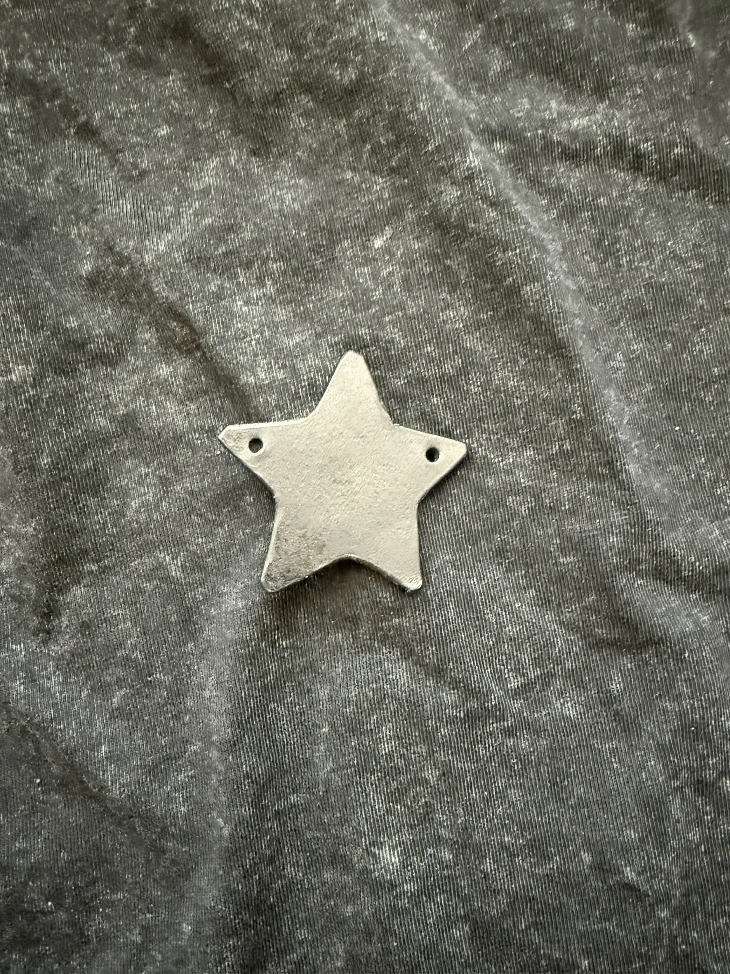 black star leather charm.jpeg
