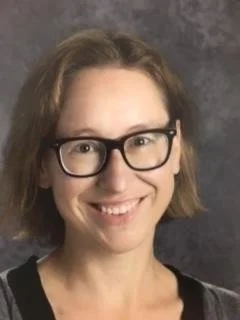 Colorful hands raised with text "We need you" on colorful blocks.