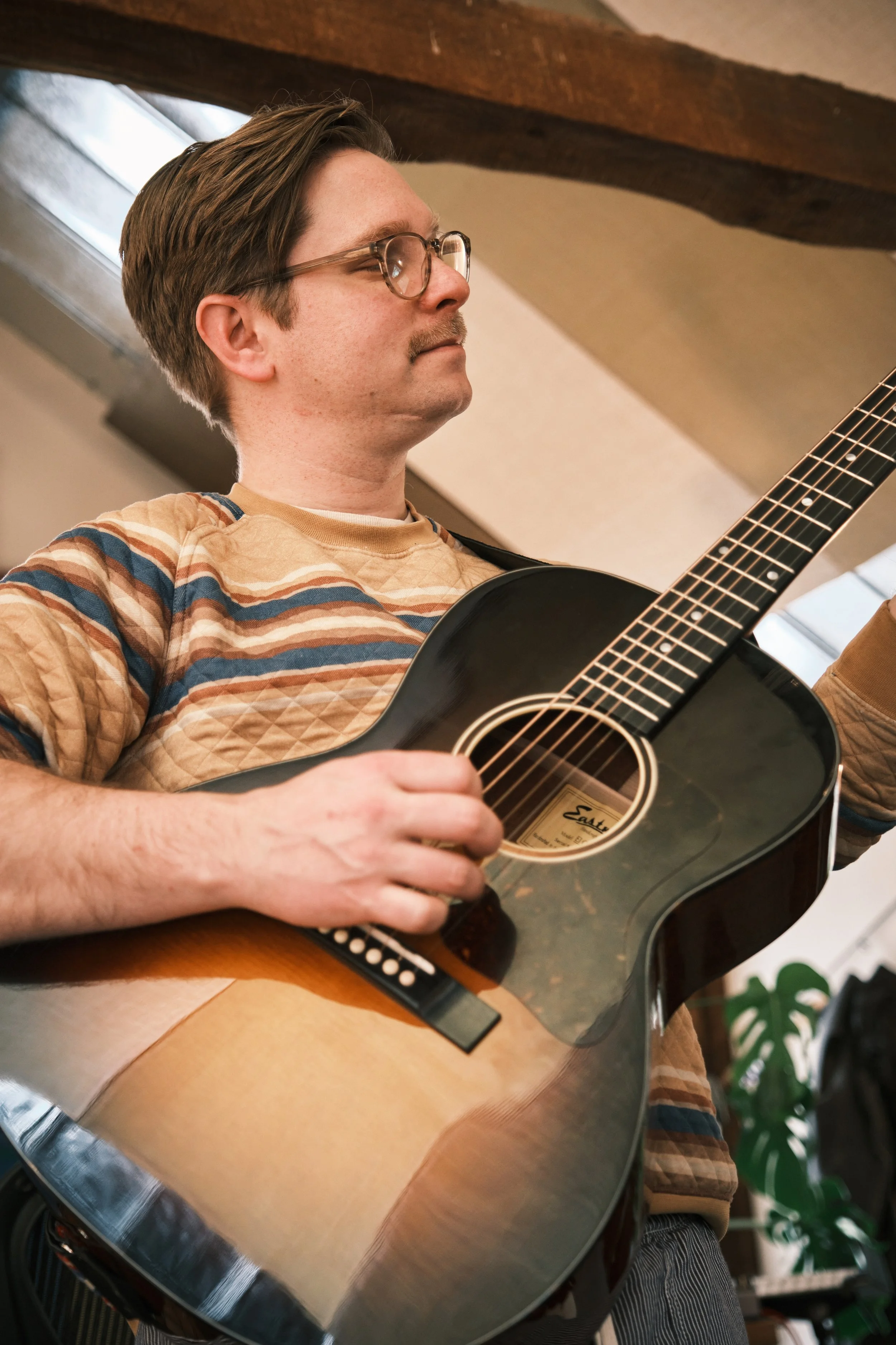 Jon Guitar Below.jpeg