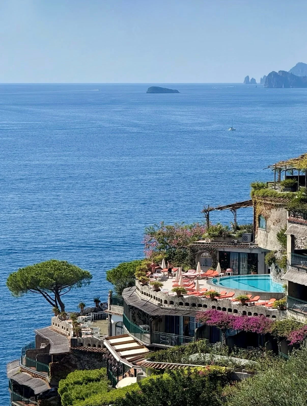 Il San Pietro. One of my favorite stays in Italy.

Set above Positano and carved into the coast, every room opens to its own terrace with sweeping views of the Amalfi Coast. An elevator takes you down to the private beach club. 

Michelin-starred din