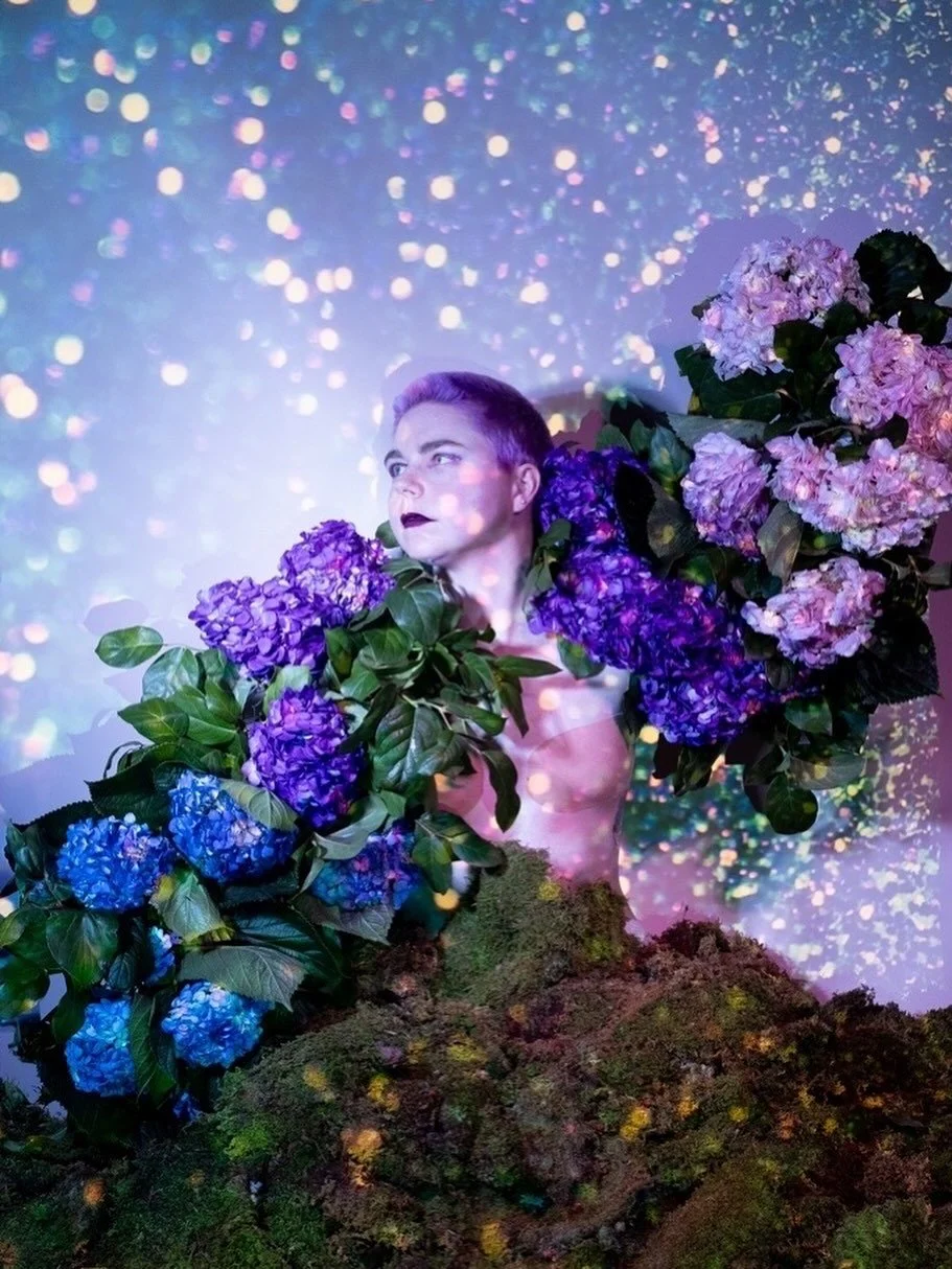 Happy Trans Day of Visibility!! Here is me being visible in all my transness! 🏳️&zwj;⚧️
Like a hydrangea that changes color with the ph of the soil, my gender tends to bounce around based on context, season, and mood. For this reason I identify as n