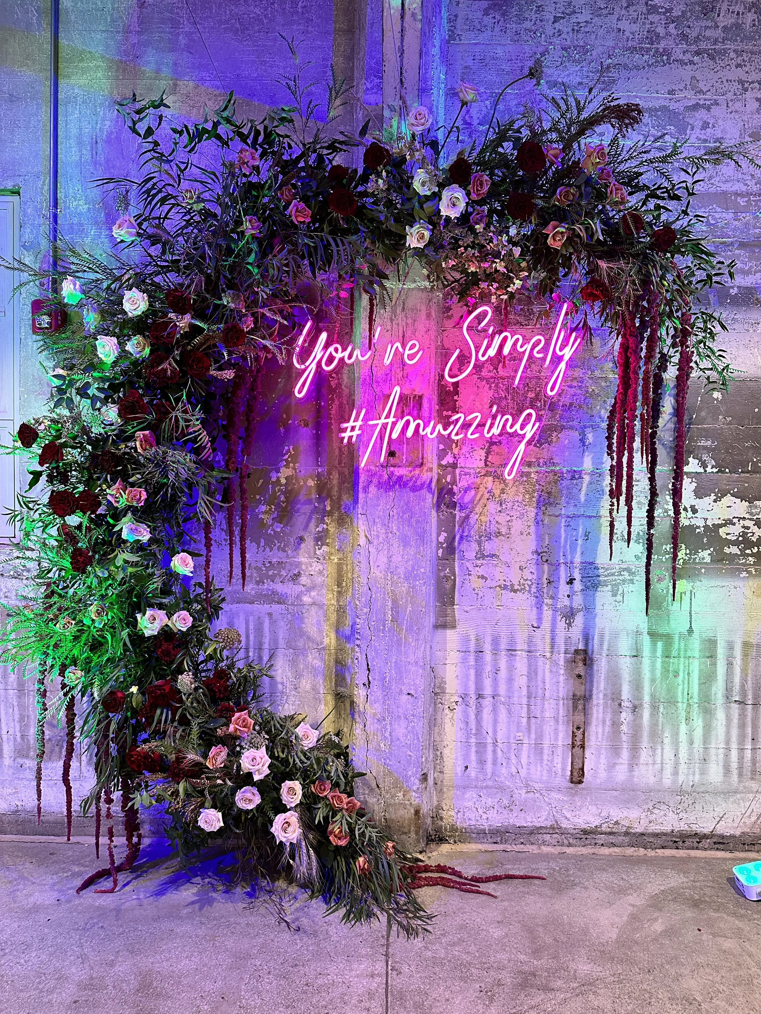 a floating floral sculpture for a birthday party in garage b