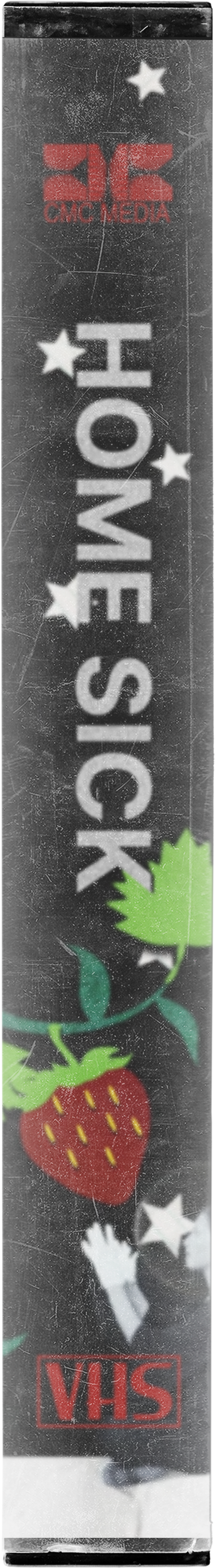 VHS tape with the title 'Home SICK' in large white letters, decorated with stars, a strawberry, and cartoon hands, with a logo for CMC Media at the top and VHS at the bottom.
