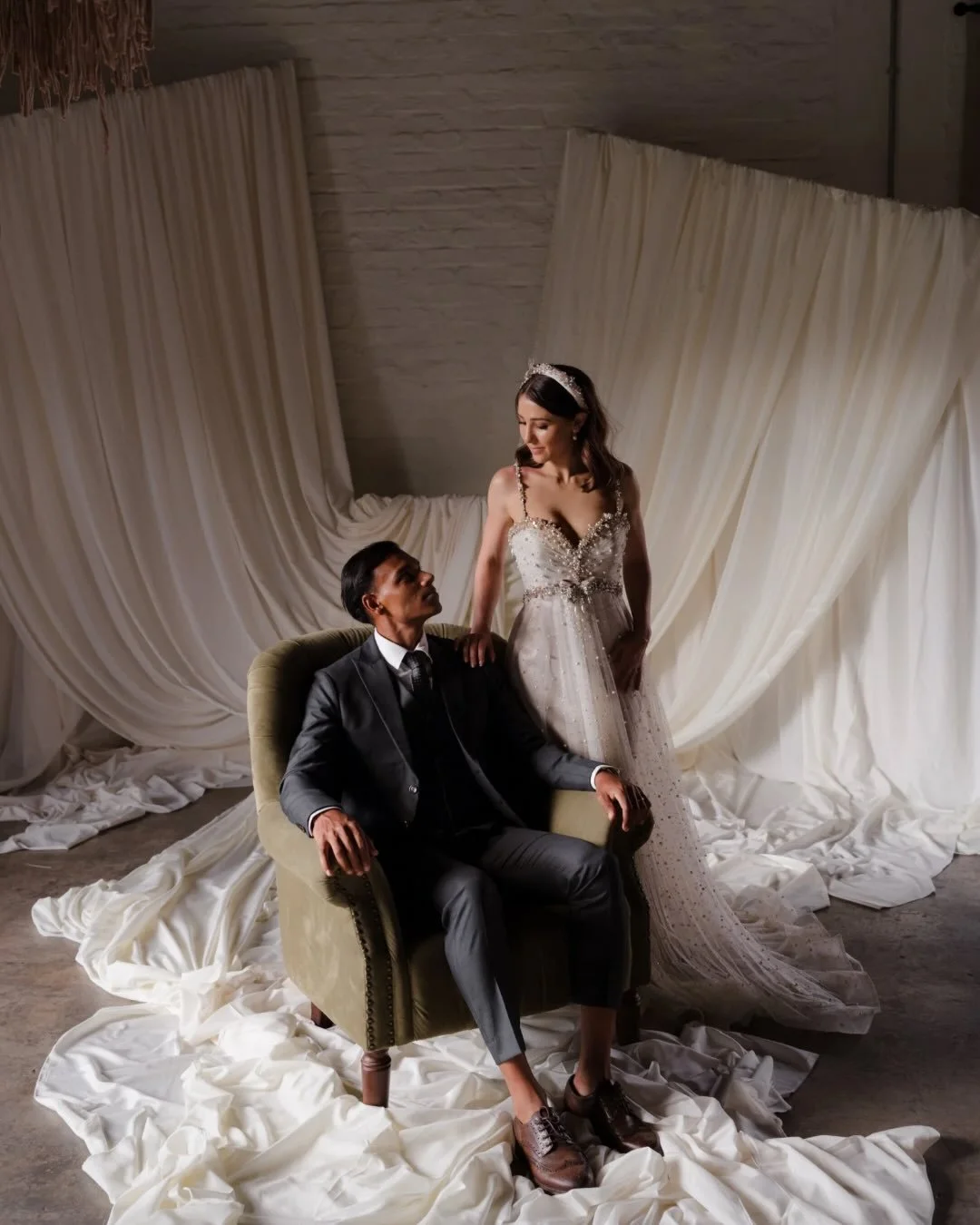 Sometimes, the weather throws a wrench in the plans…
and creates something even more special.

Here, the ceremony setup was moved indoors at Laborie Estate, a venue that offers beautiful alternatives when the weather changes.

Layers of fabric, a suspended 