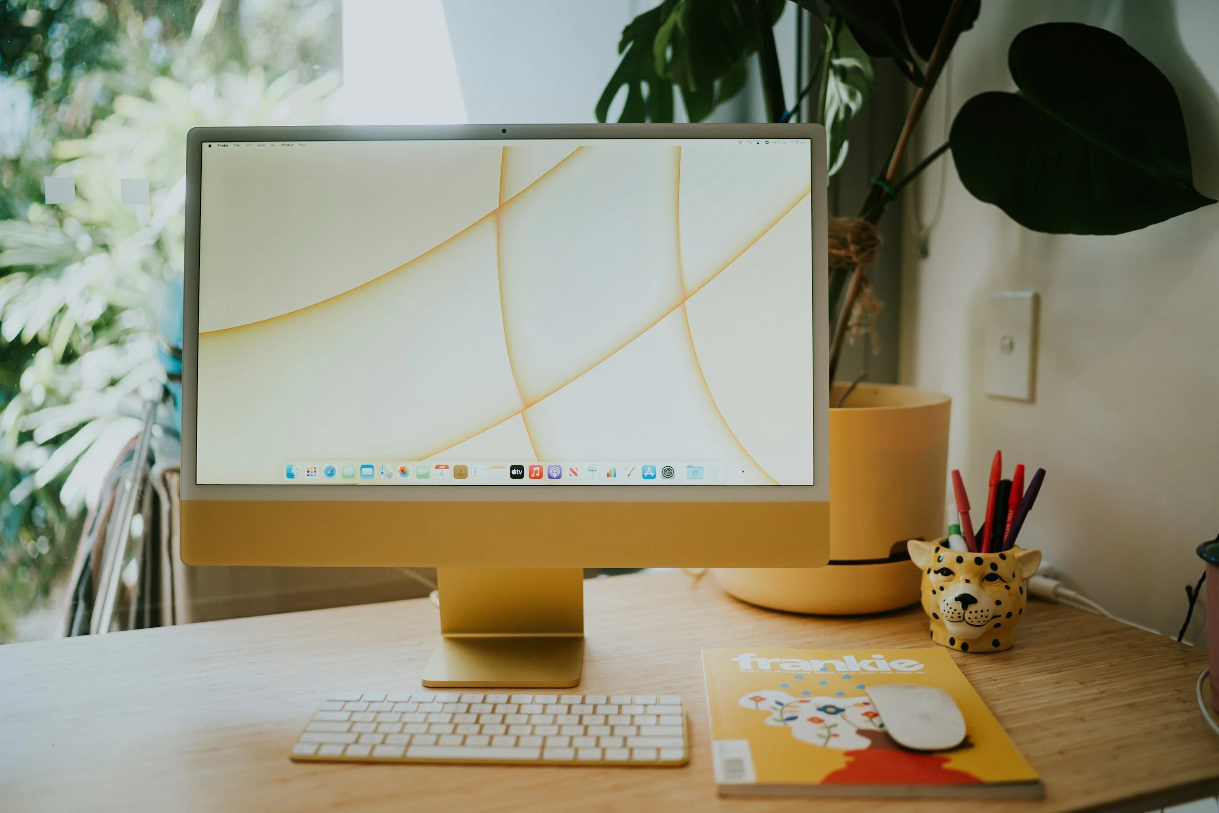 Image is a yellow iMac. The Copy Trust helps businesses increase revenue.