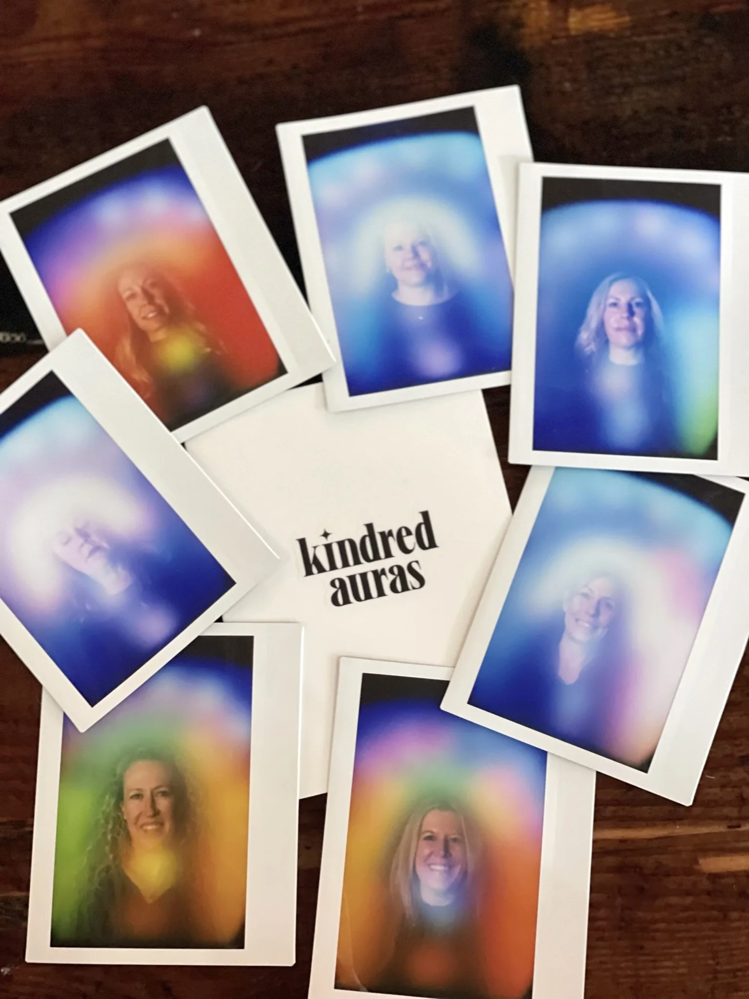  a collection of kindred aura photographs spread on table 