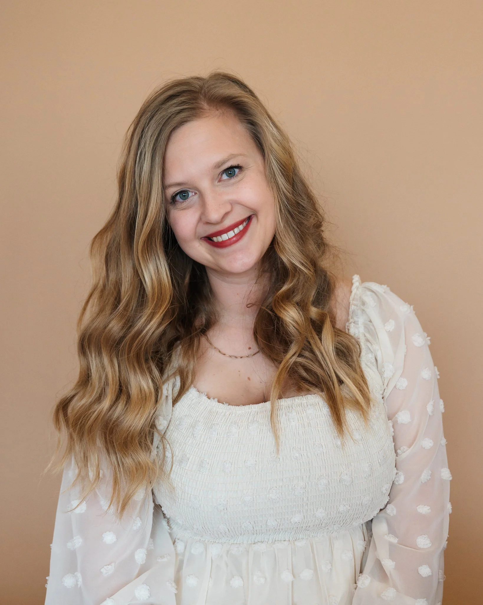 headshot of female smiling at camera