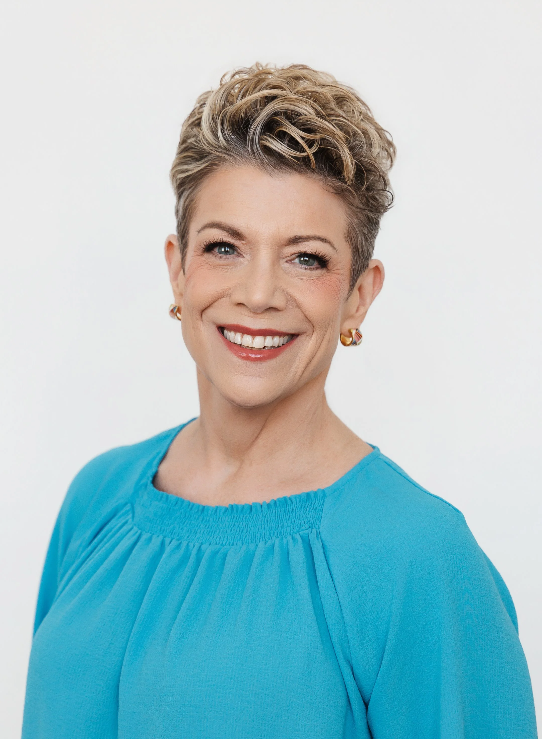 smiling headshot client with beautifully polished makeup